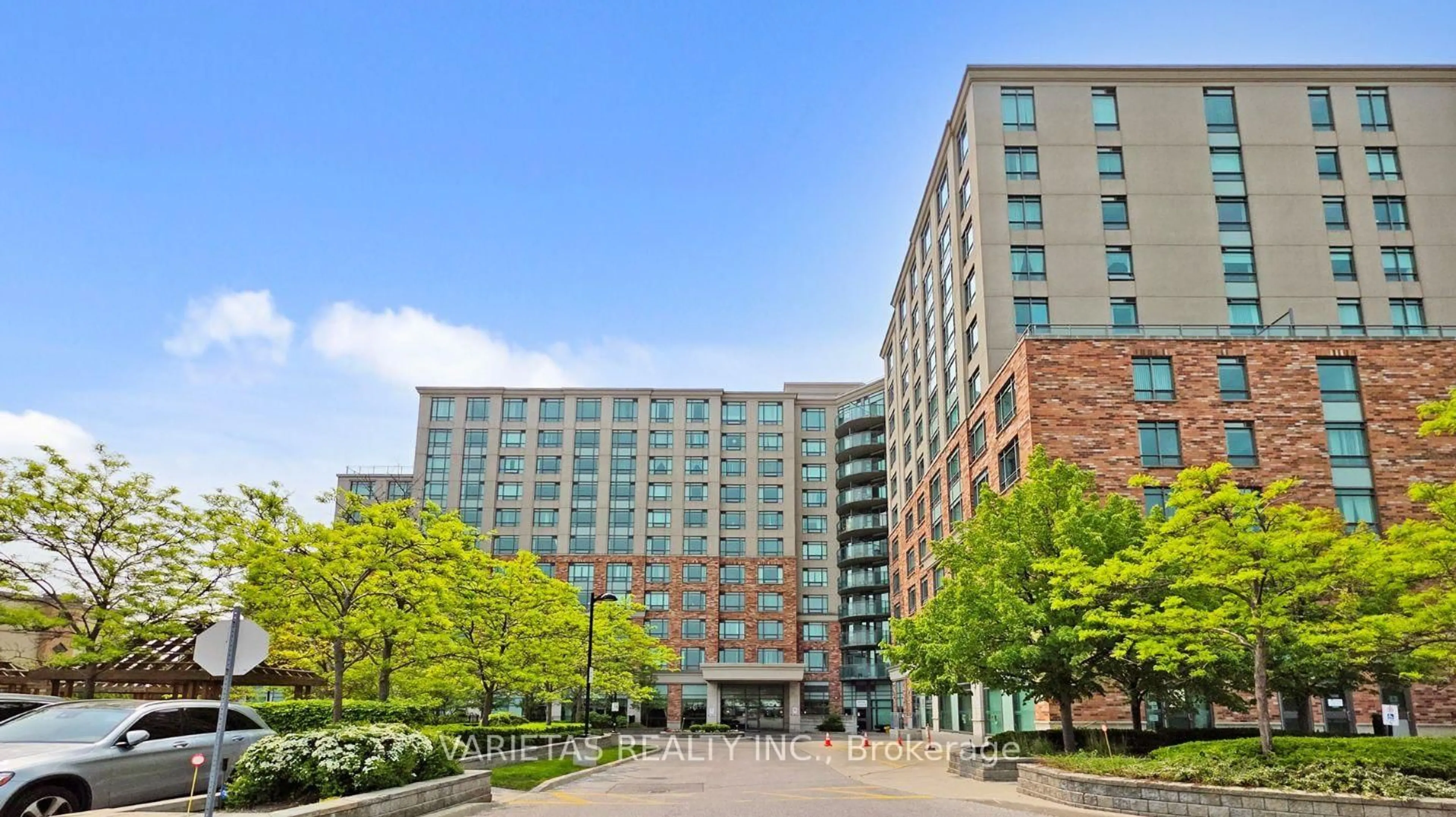 Patio, city buildings view from balcony for 45 Kingsbridge Garden Circ #702, Mississauga Ontario L5R 3K4