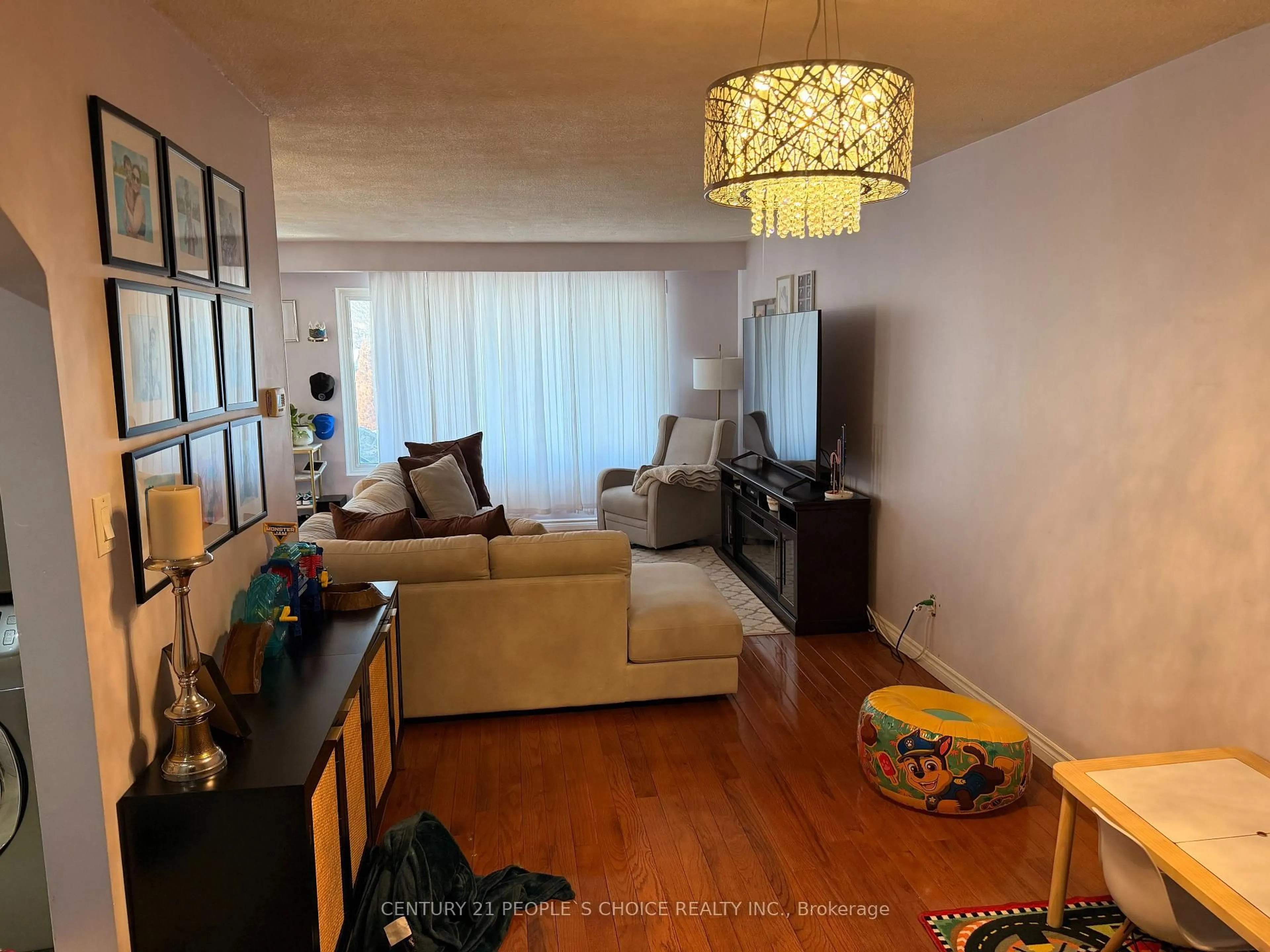 Living room with furniture, wood/laminate floor for 46 Abell Dr, Brampton Ontario L6V 2V8