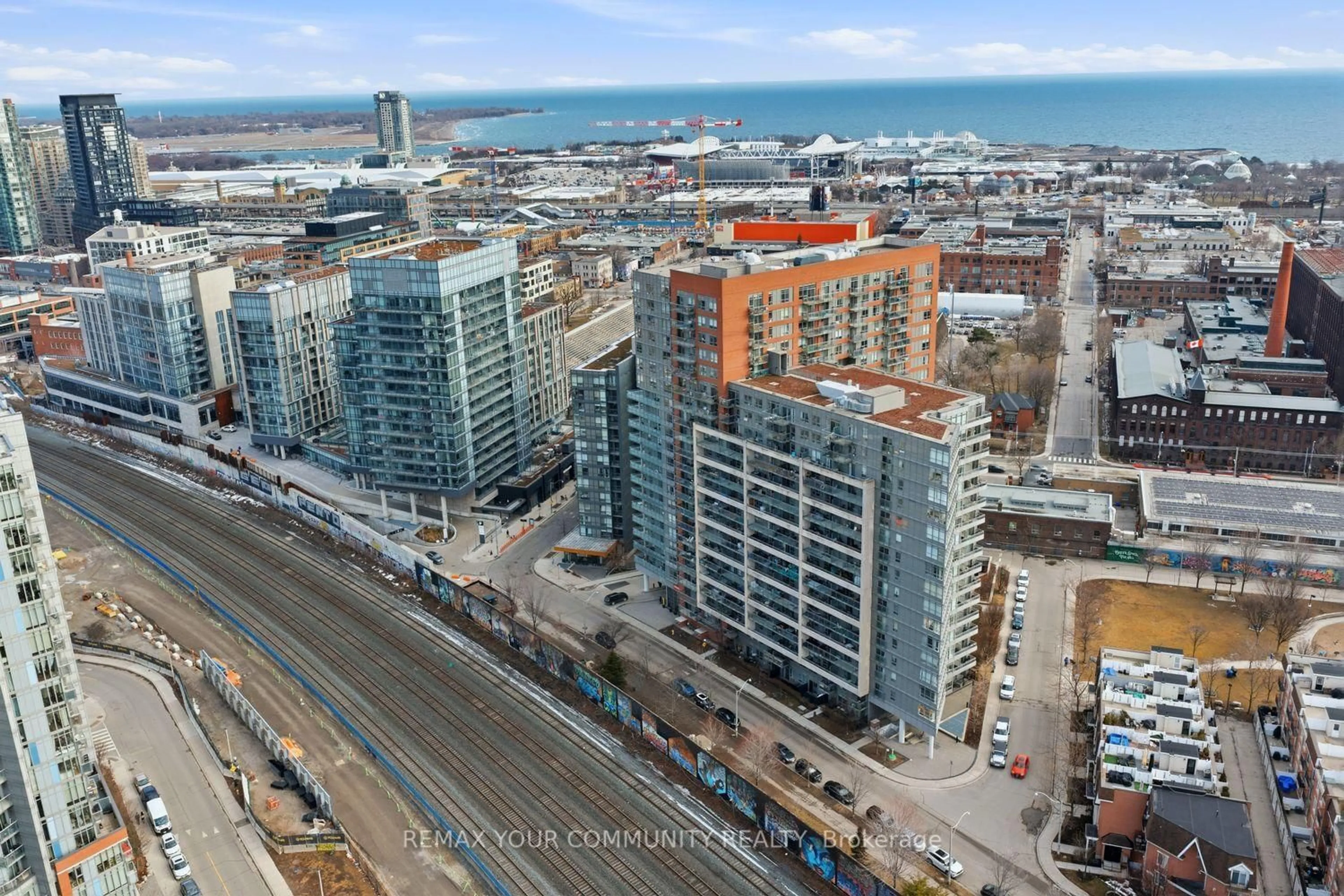 A pic from outside/outdoor area/front of a property/back of a property/a pic from drone, city buildings view from balcony for 38 Joe Shuster Way #1526, Toronto Ontario M6K 0A5