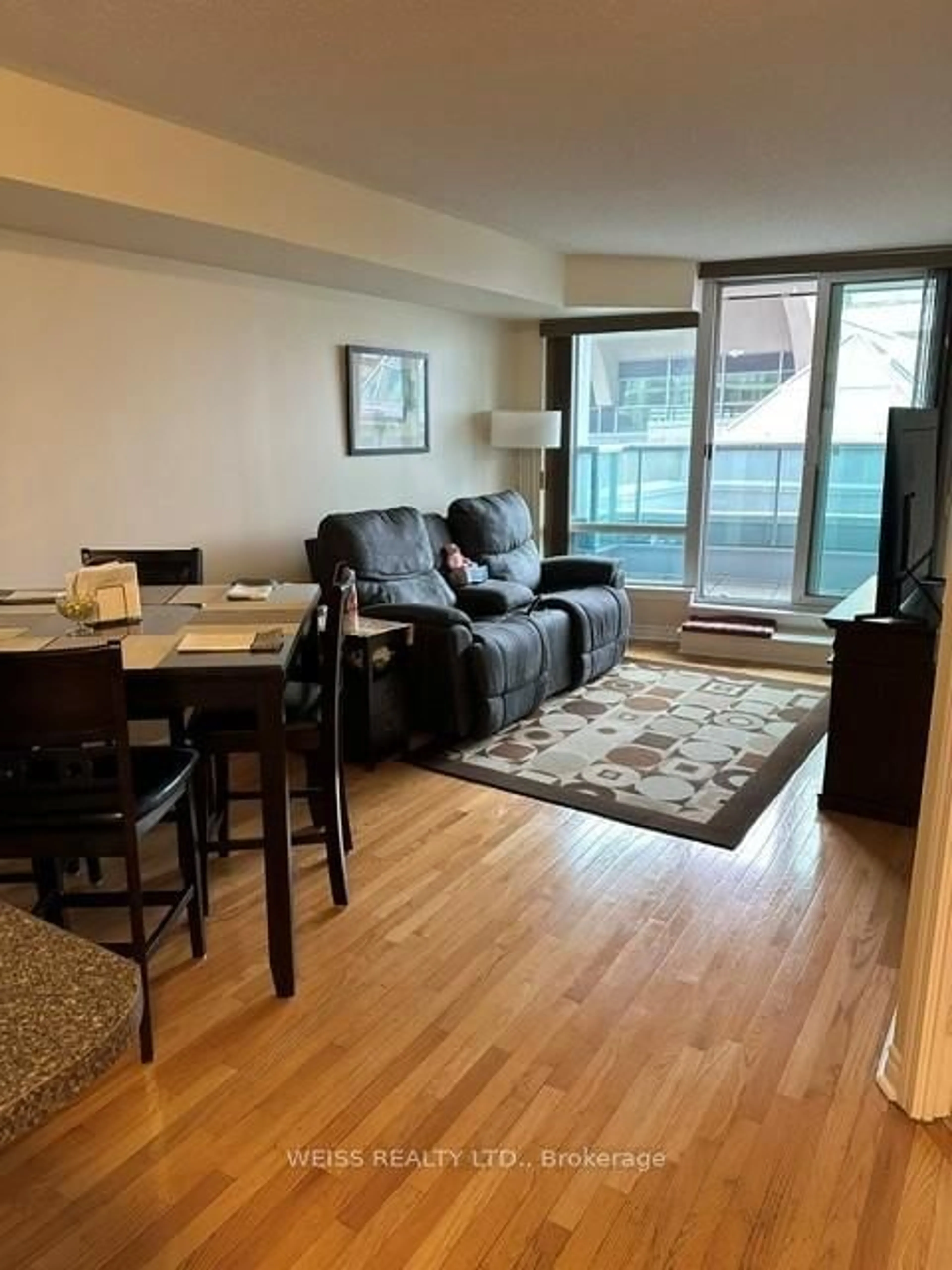 Living room with furniture, wood/laminate floor for 33 Elm Dr #310, Mississauga Ontario L5B 4M2