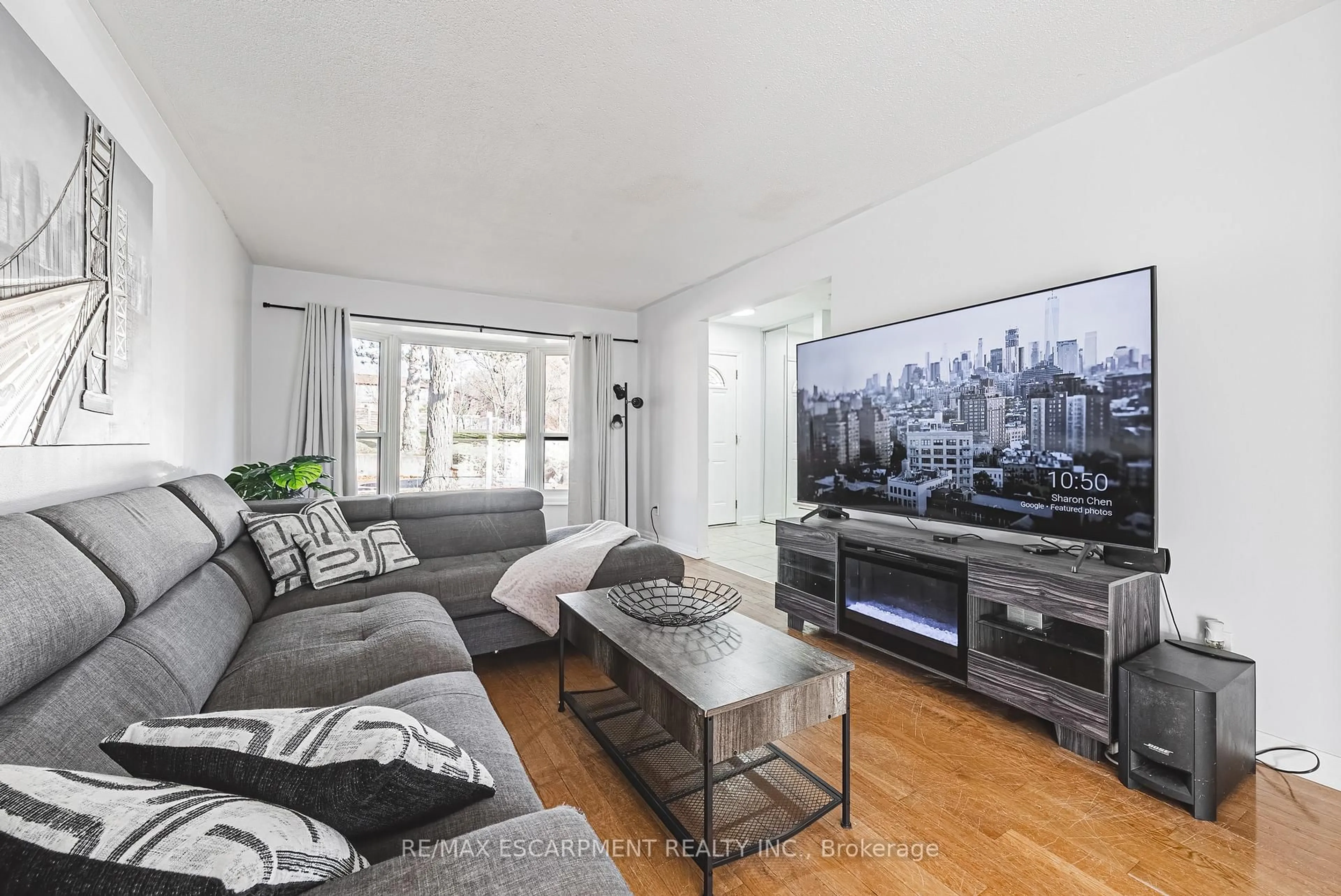 Living room with furniture, wood/laminate floor for 2220 UPPER MIDDLE Rd #4, Burlington Ontario L7P 3P4