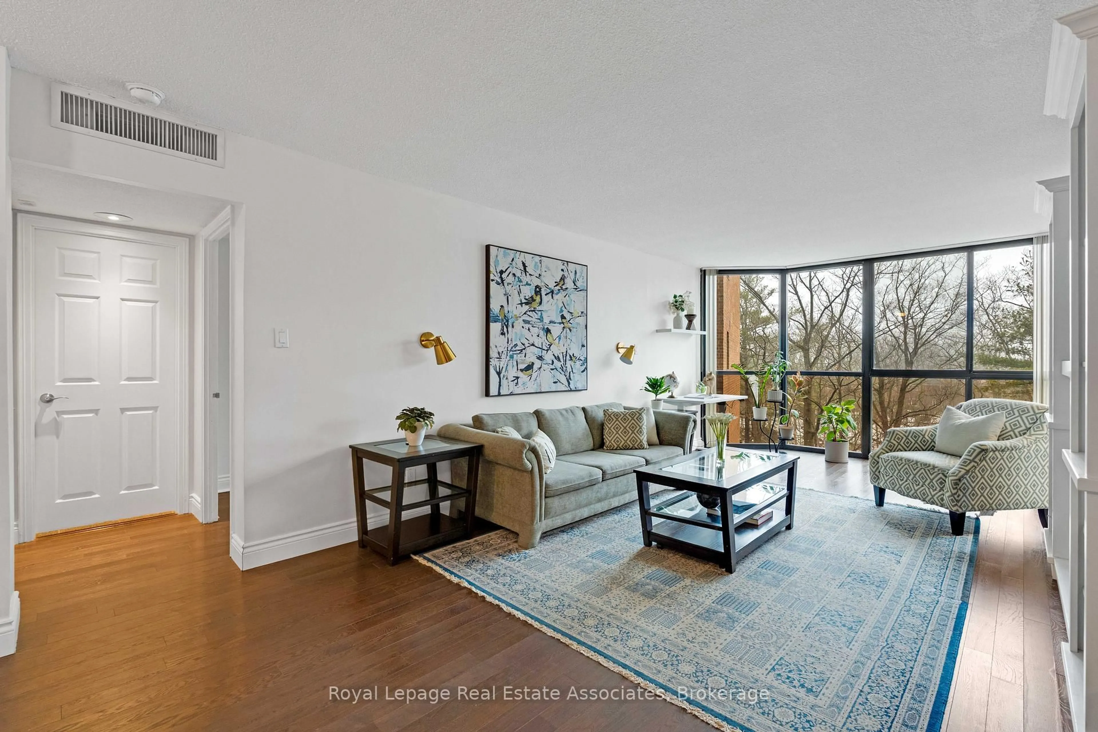 Living room with furniture, unknown for 1240 Marlborough Crt #402, Oakville Ontario L6H 3K7