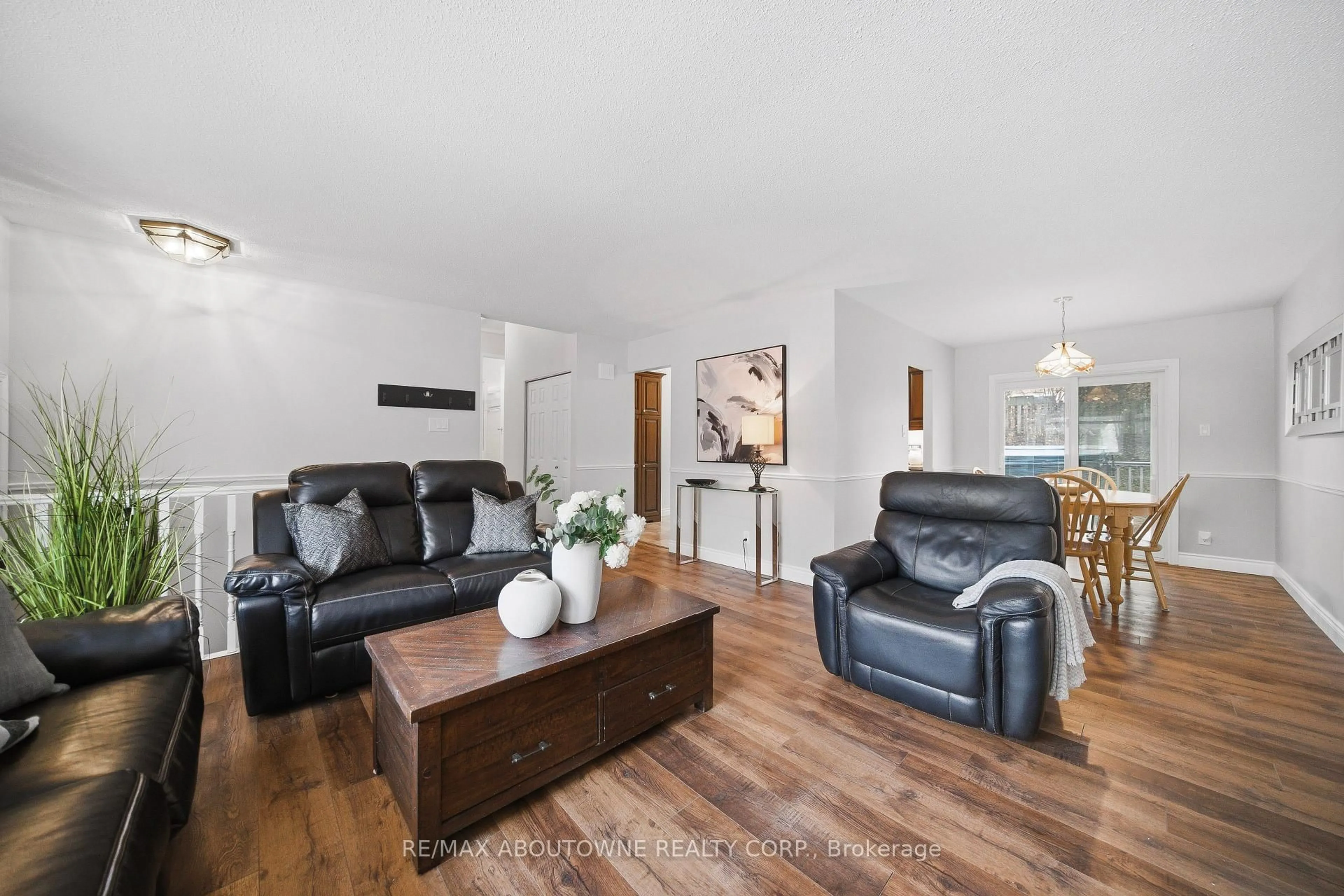 Living room with furniture, wood/laminate floor for 129 Culham St, Oakville Ontario L6H 1G3