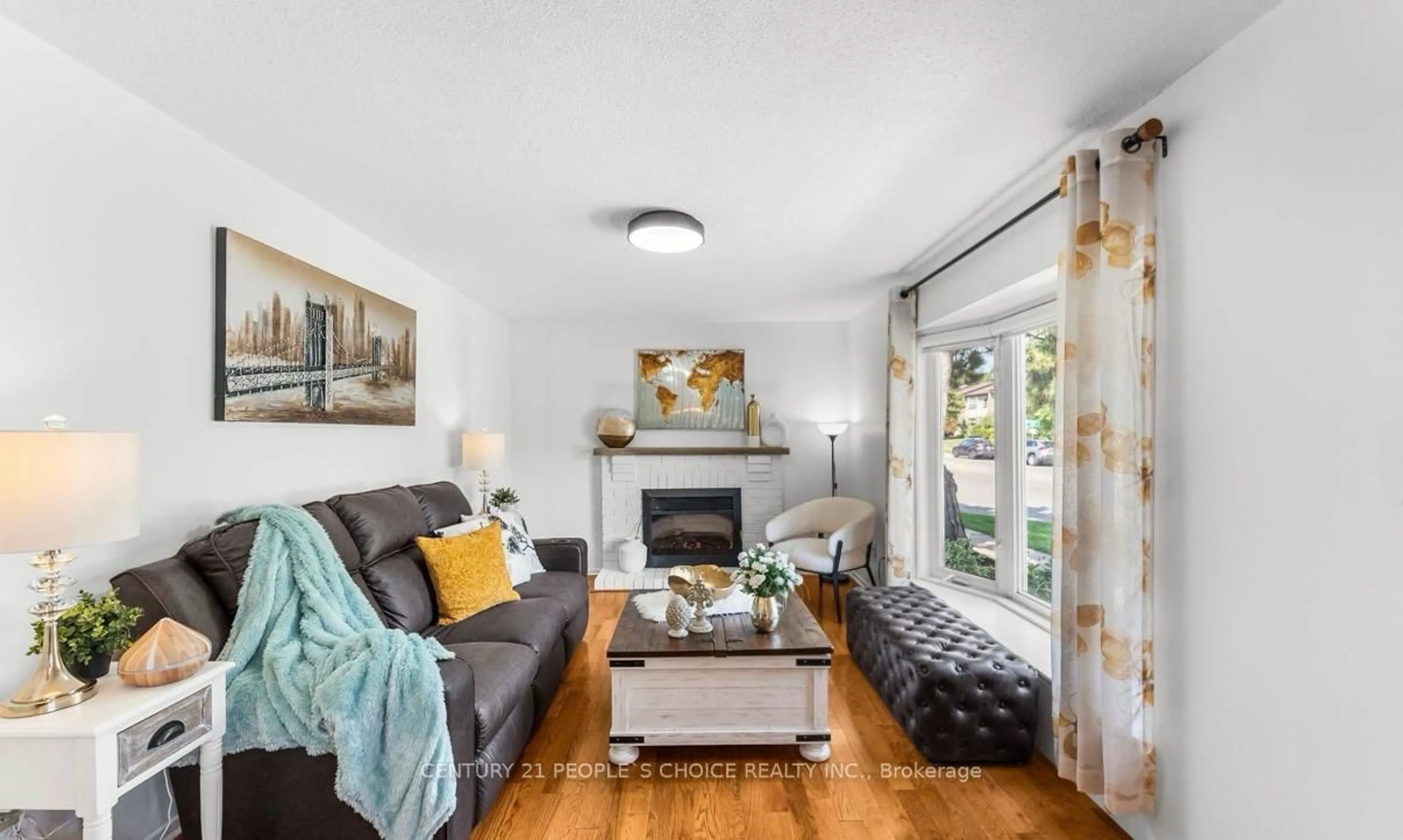 Living room with furniture, wood/laminate floor for 2 Mangrove Rd, Brampton Ontario L6S 3Y1