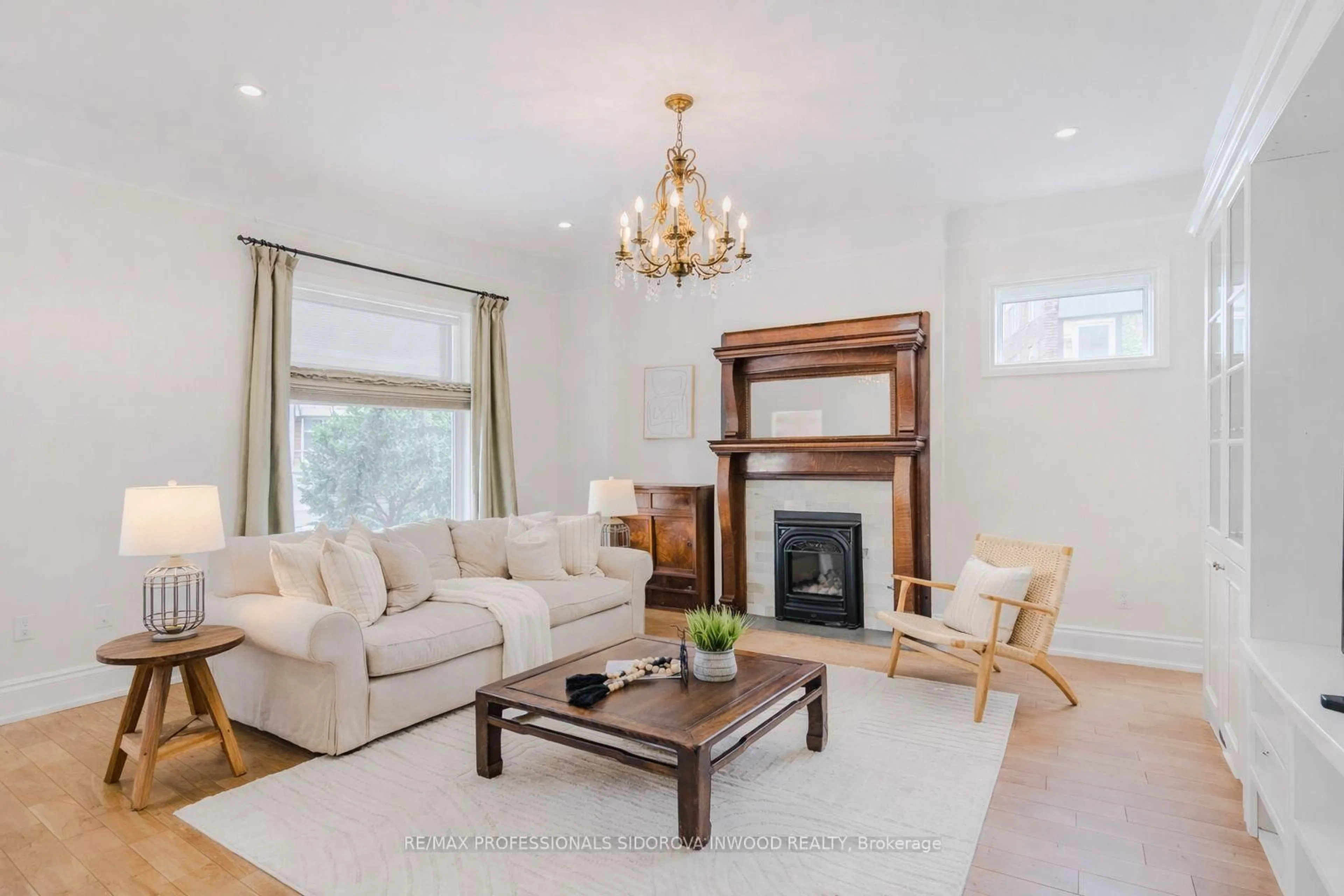 Living room with furniture, wood/laminate floor for 51 Harvard Ave, Toronto Ontario M6R 1C7