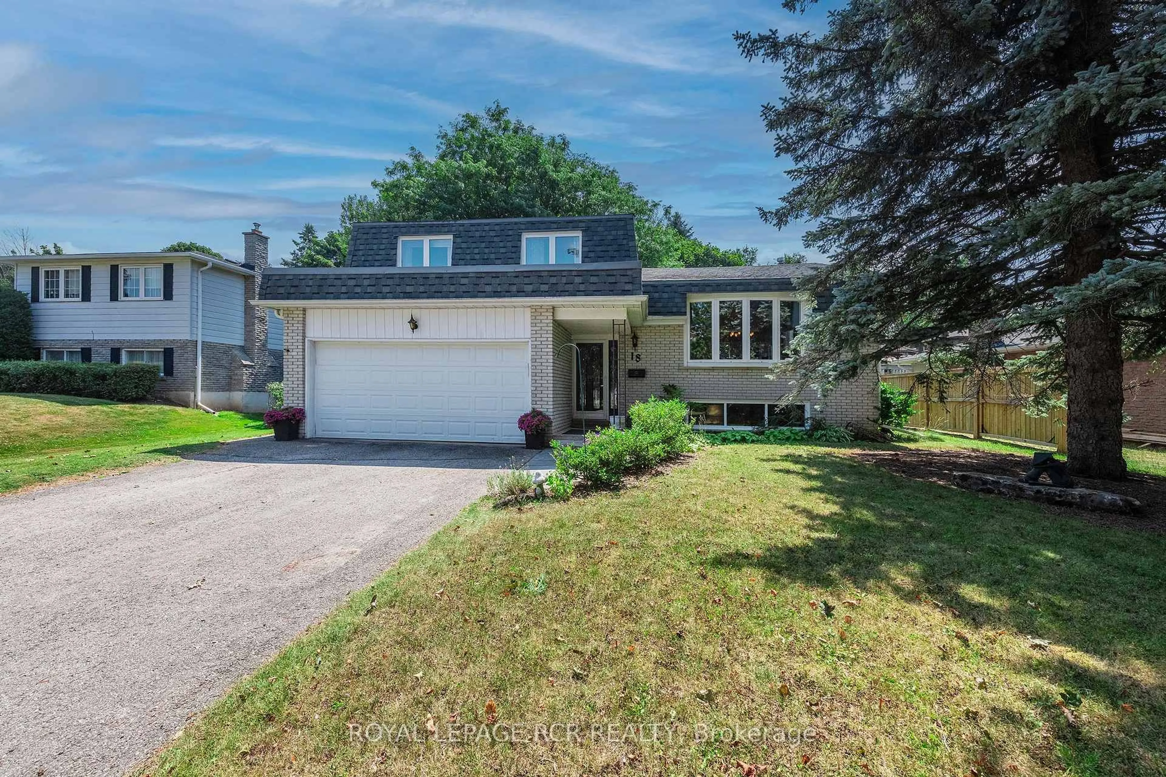 Home with vinyl exterior material, street for 18 Westmorland Ave, Orangeville Ontario L9W 3B6