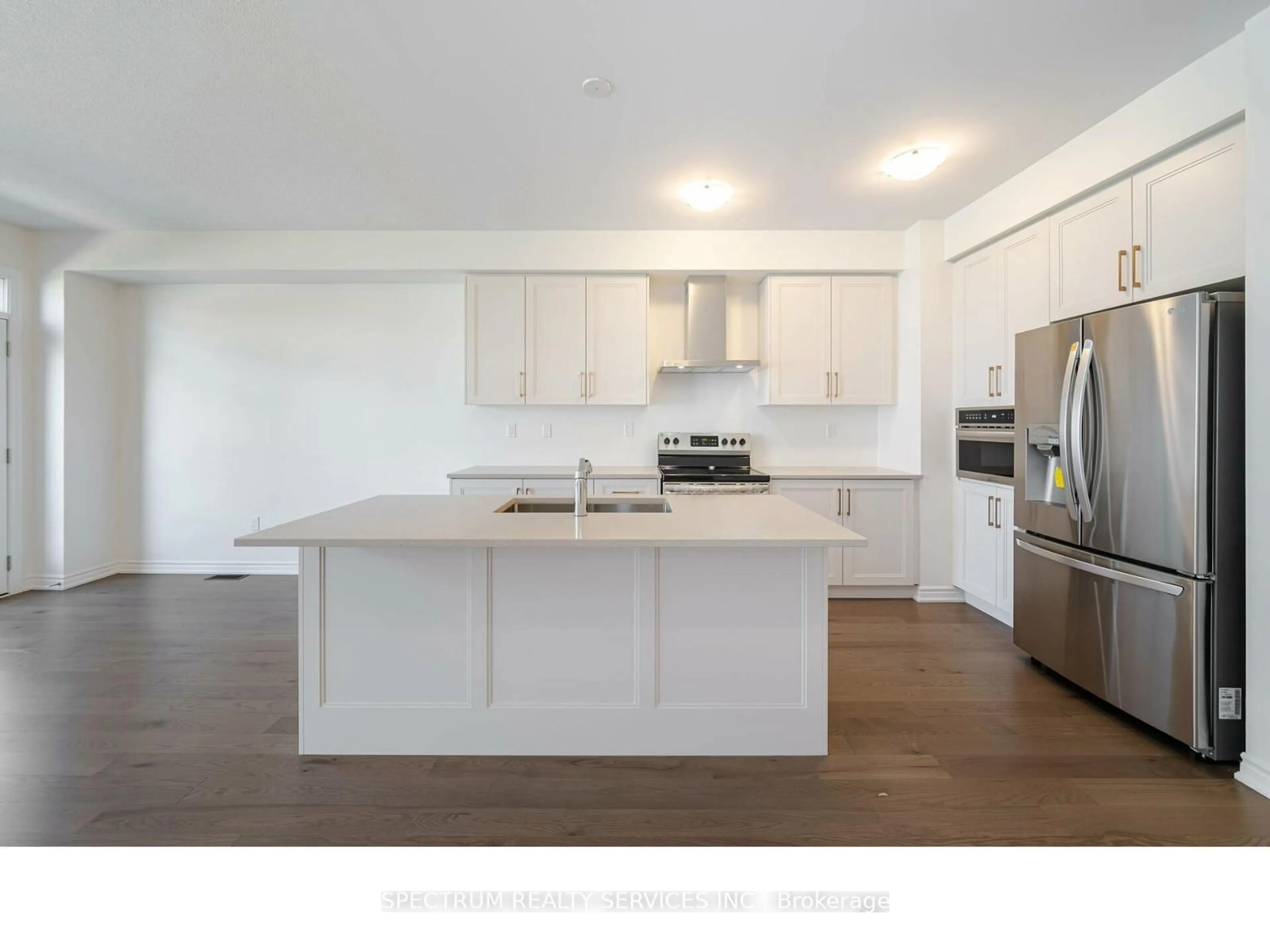 Open concept kitchen, wood/laminate floor for 1437 Watercress Way, Milton Ontario L9T 2X5