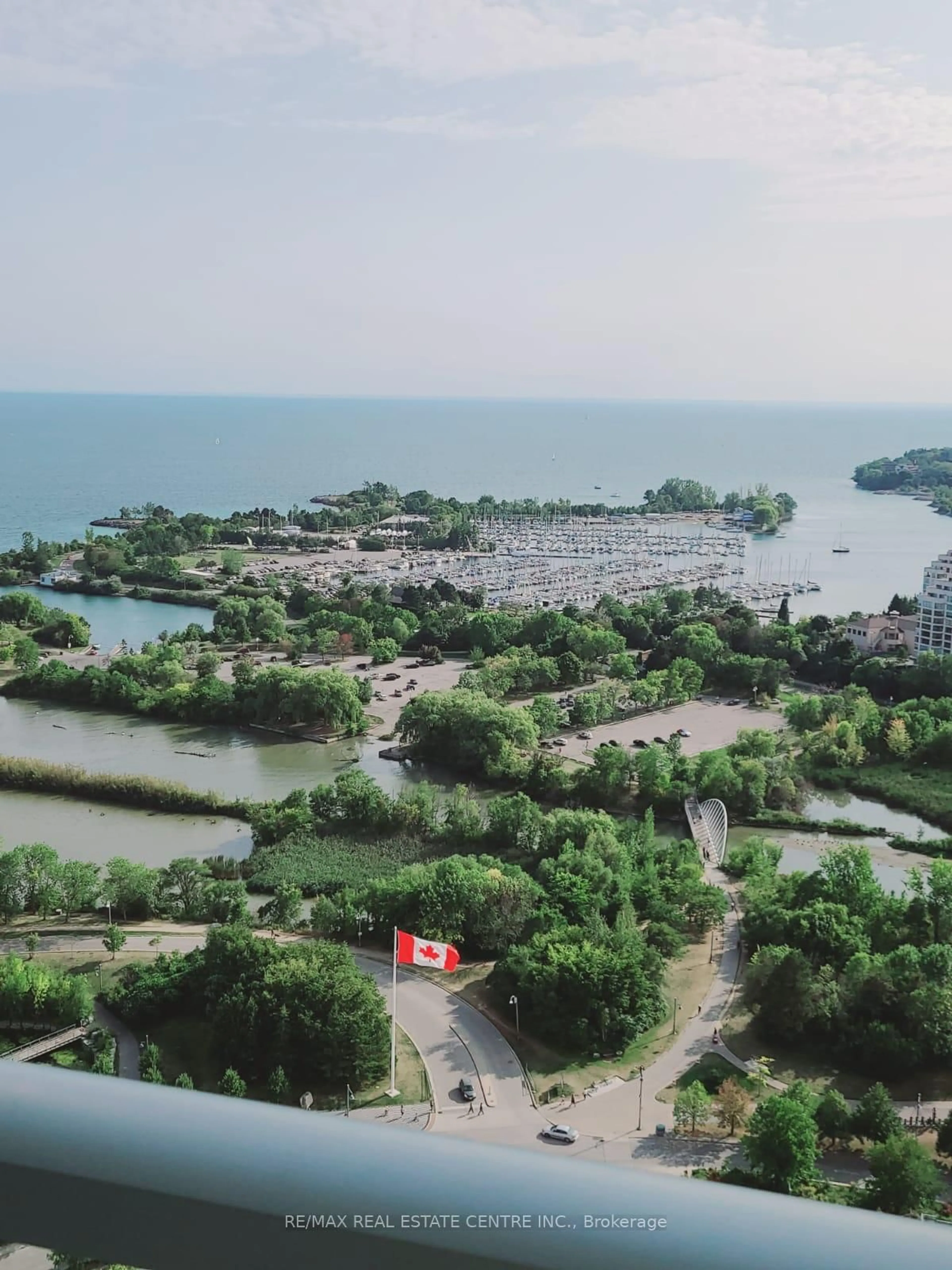 A pic from outside/outdoor area/front of a property/back of a property/a pic from drone, water/lake/river/ocean view for 33 Shore Breeze Dr #2611, Toronto Ontario M8V 0G1