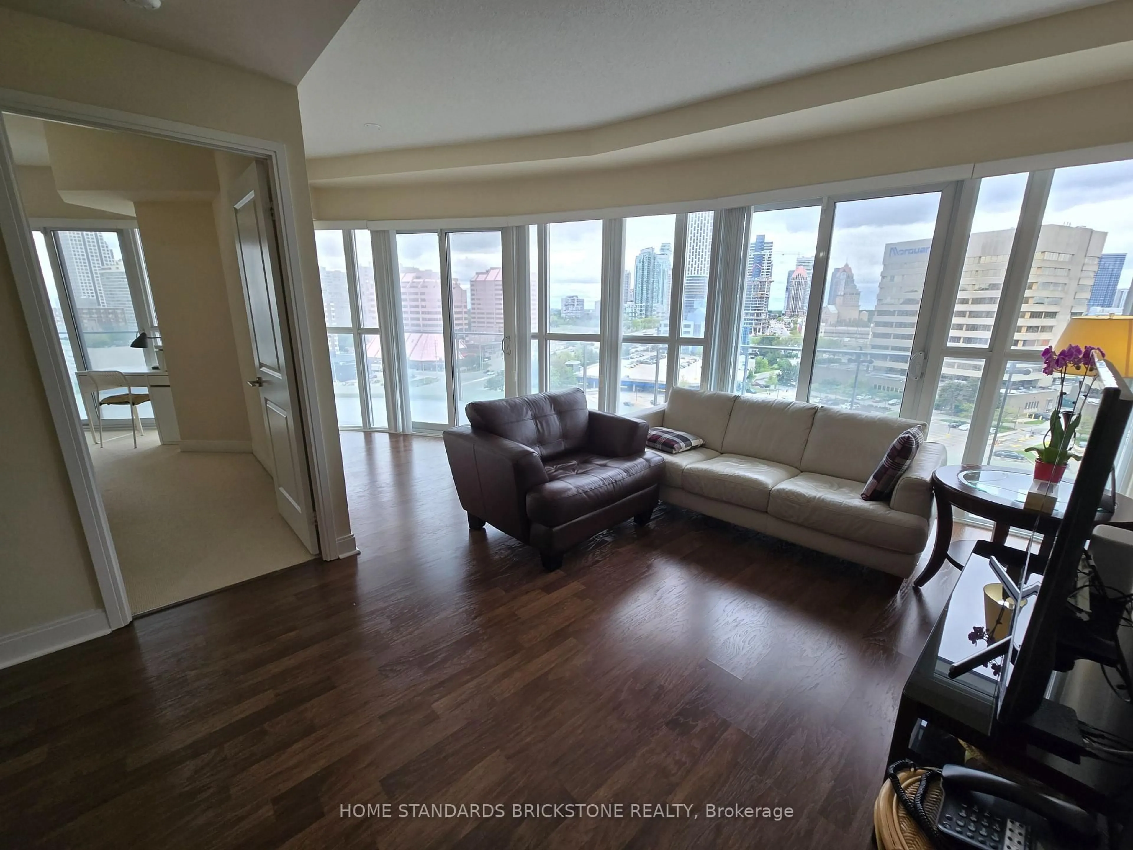Living room with furniture, wood/laminate floor for 50 Absolute Ave #1106, Mississauga Ontario L4Z 0A8