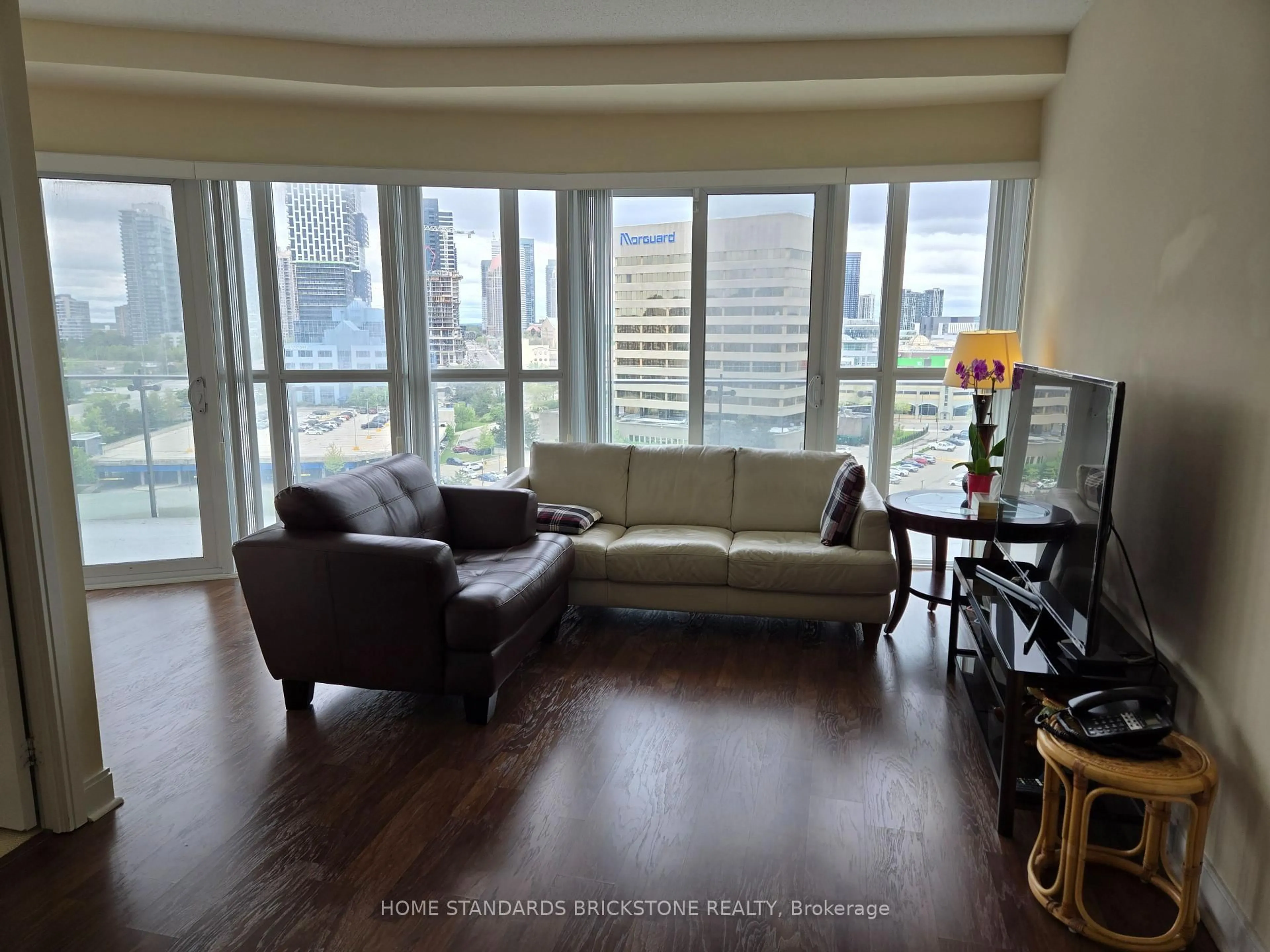 Living room with furniture, wood/laminate floor for 50 Absolute Ave #1106, Mississauga Ontario L4Z 0A8