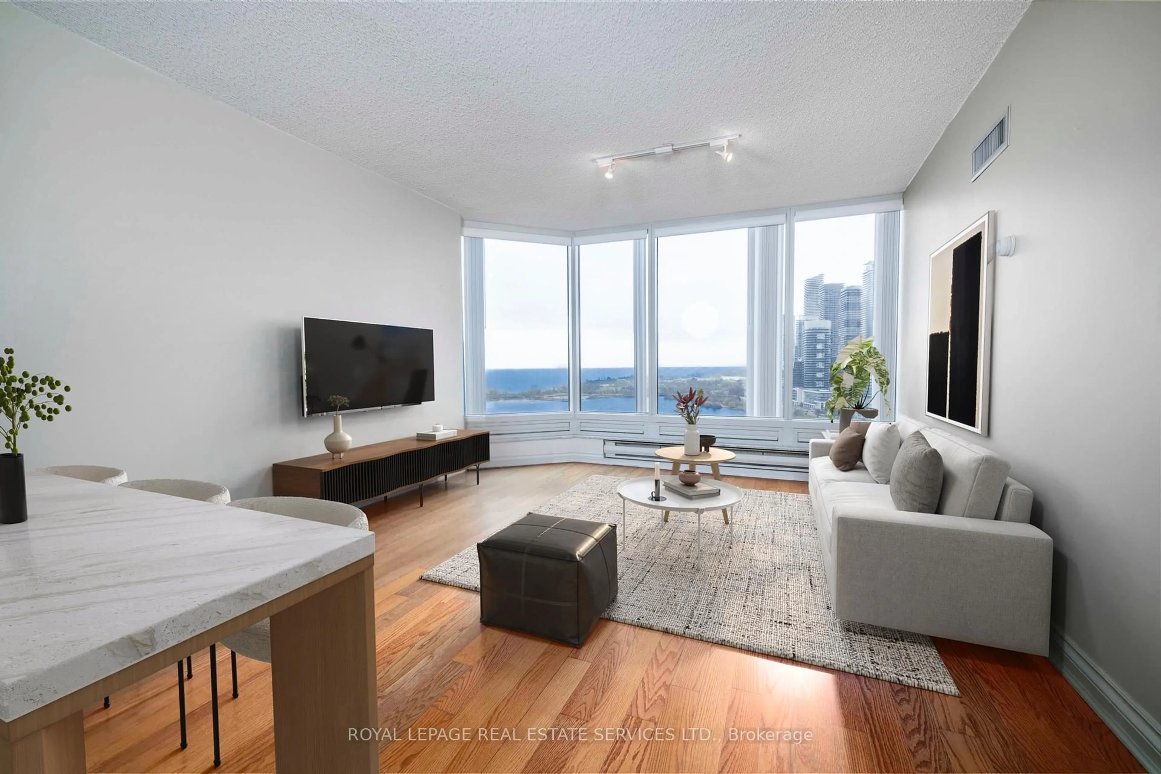 Living room with furniture, wood/laminate floor for 1 Palace Pier Crt #2104, Toronto Ontario M8V 3W9
