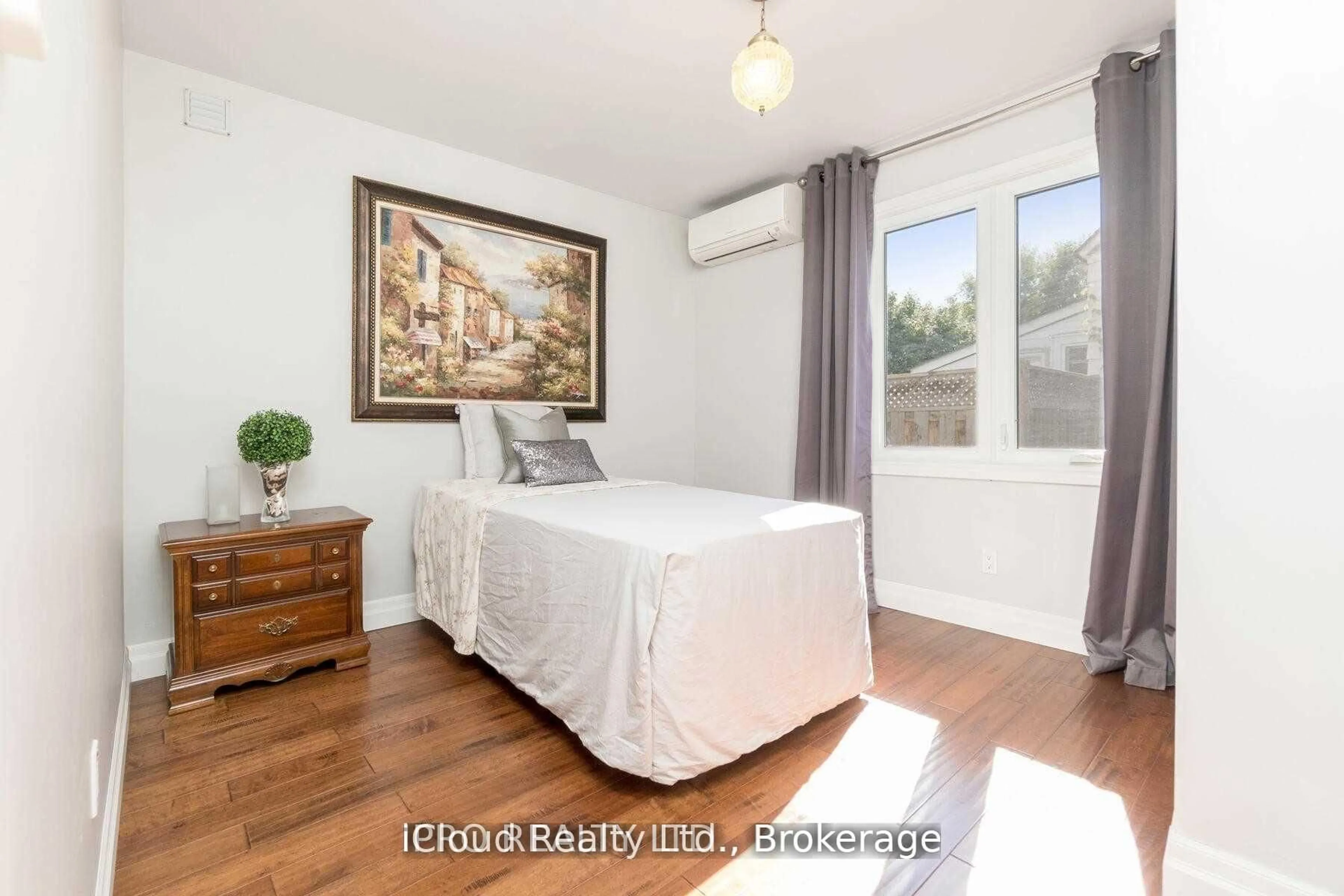 Bedroom with bed, wood/laminate floor for 18 Sunset Blvd, Brampton Ontario L6X 1W8