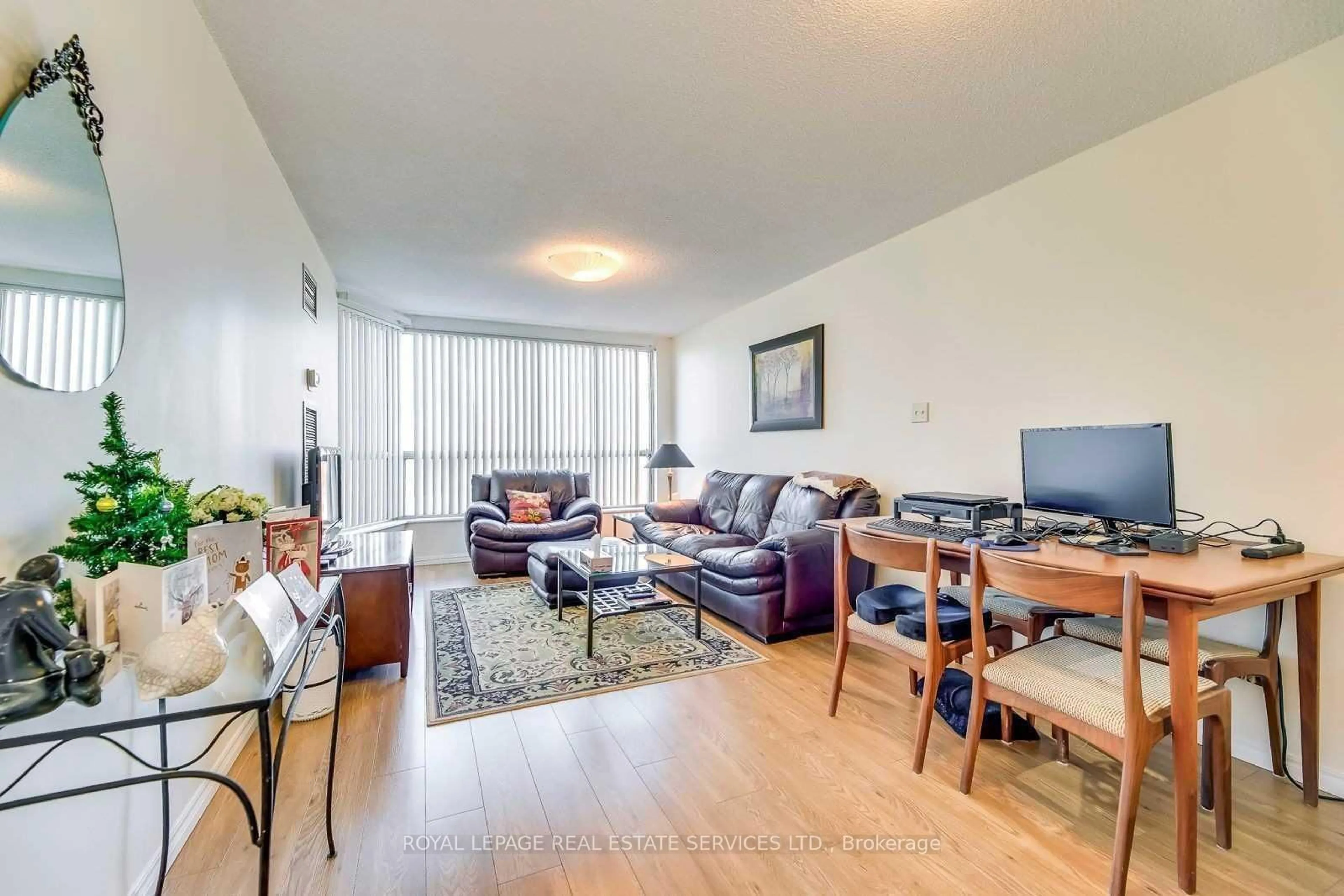Living room with furniture, wood/laminate floor for 1110 Walden Circ #709, Mississauga Ontario L5J 4R3