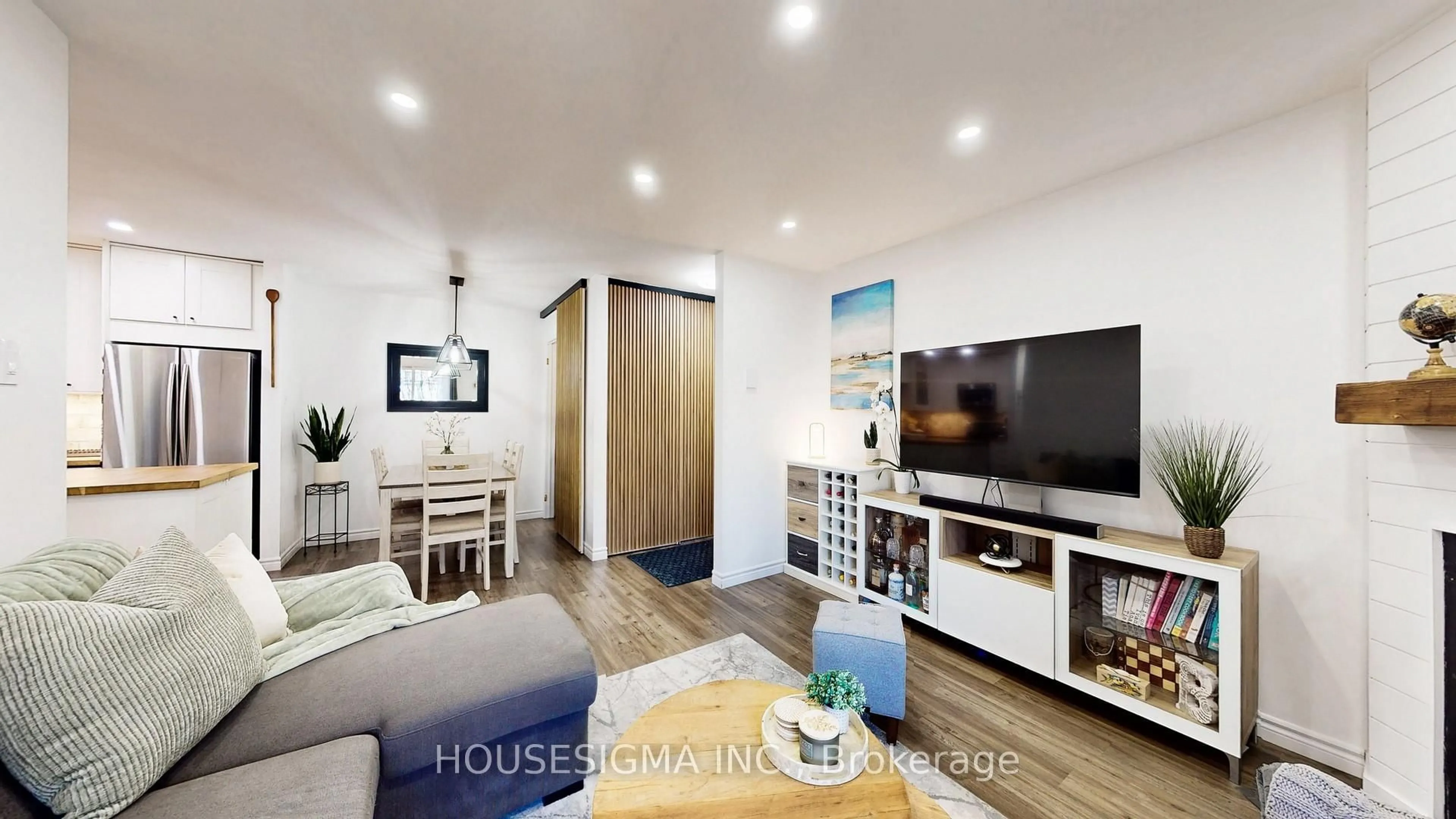 Living room with furniture, wood/laminate floor for 1496 Pilgrims Way #114, Oakville Ontario L6M 3G9