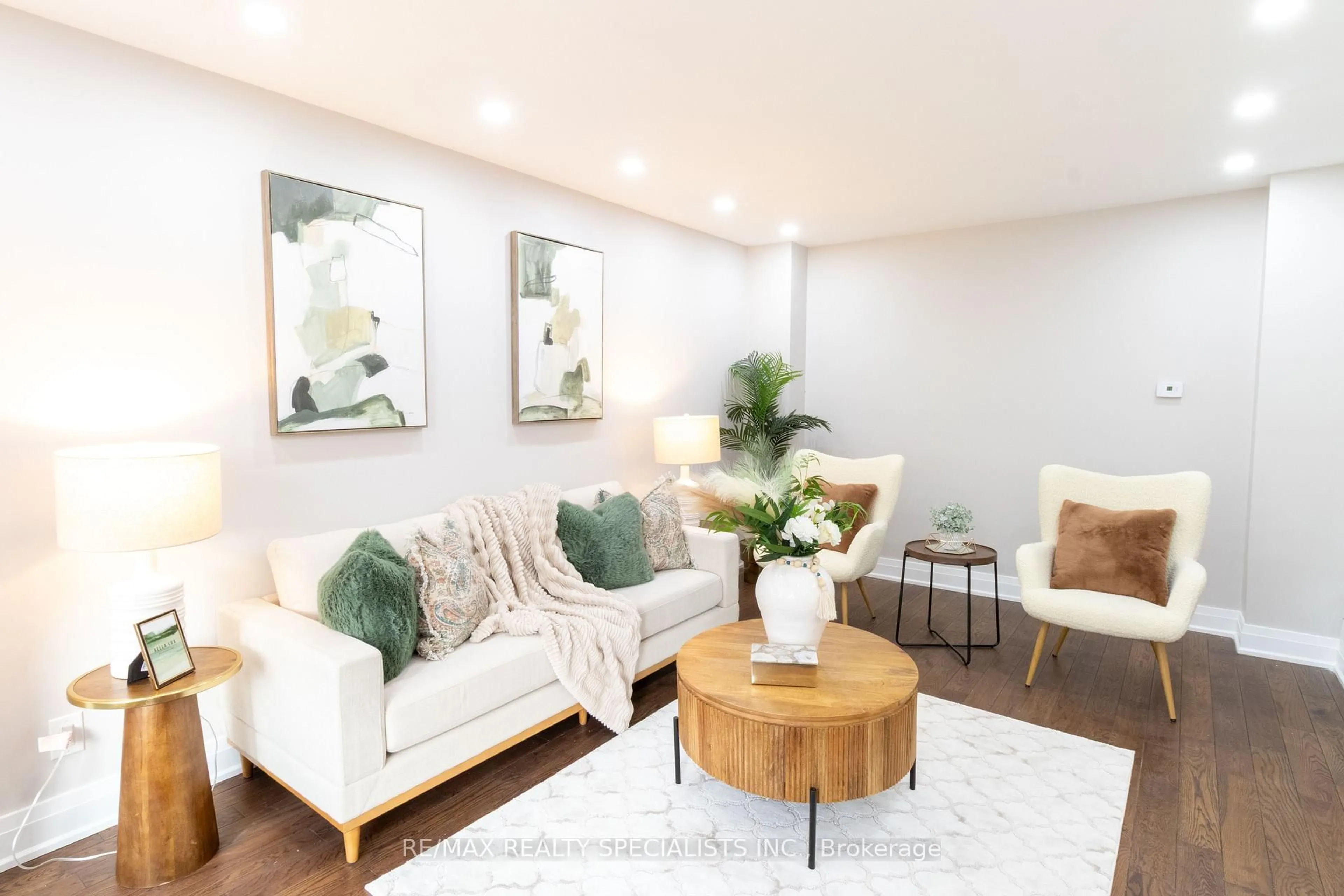 Living room with furniture, wood/laminate floor for 21 Bristol Ave, Brampton Ontario L6X 2B1