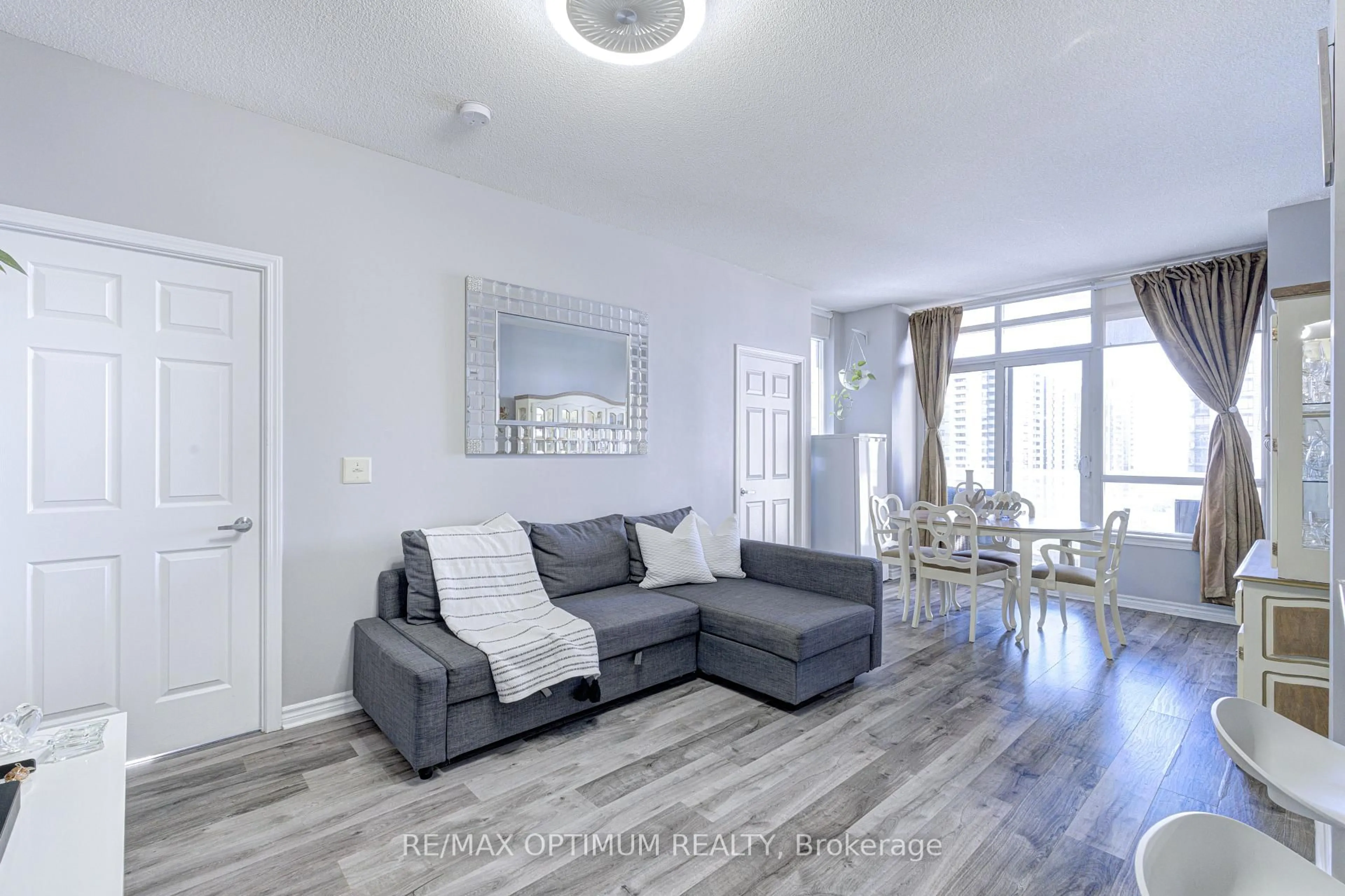 Living room with furniture, wood/laminate floor for 388 Prince Of Wales Dr #1104, Mississauga Ontario L5B 0A1