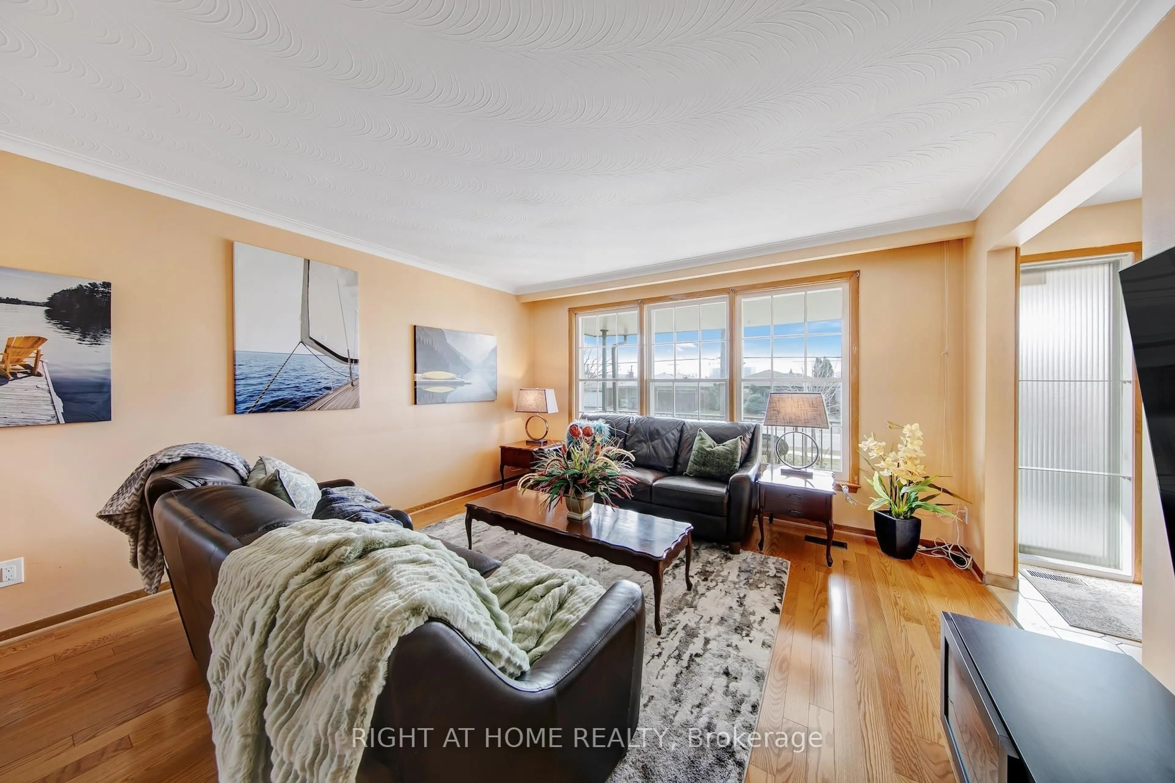 Living room with furniture, wood/laminate floor for 234 Maple Leaf Dr, Toronto Ontario M6L 1P1