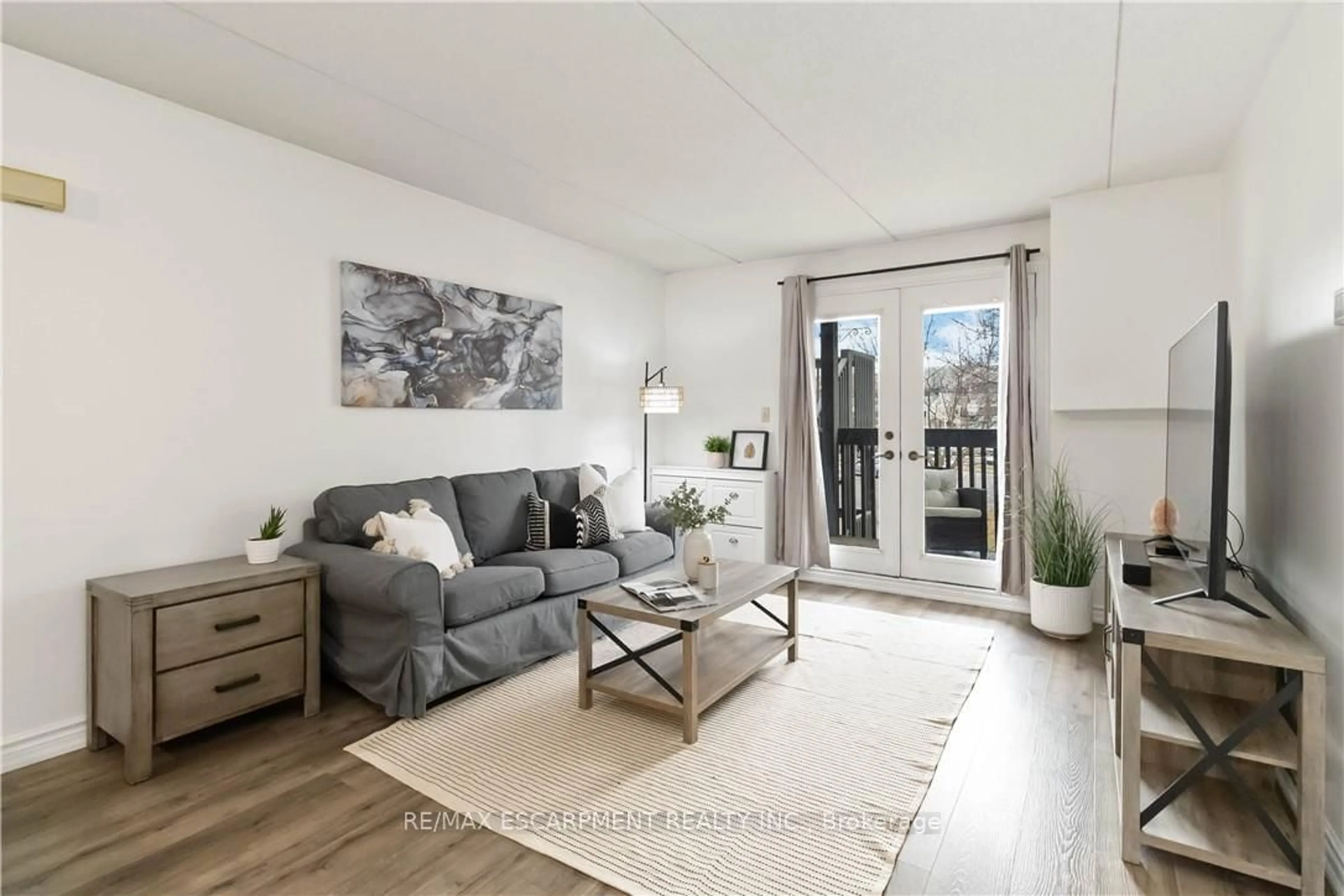 Living room with furniture, wood/laminate floor for 2030 Cleaver Ave #222, Burlington Ontario L7M 4C3