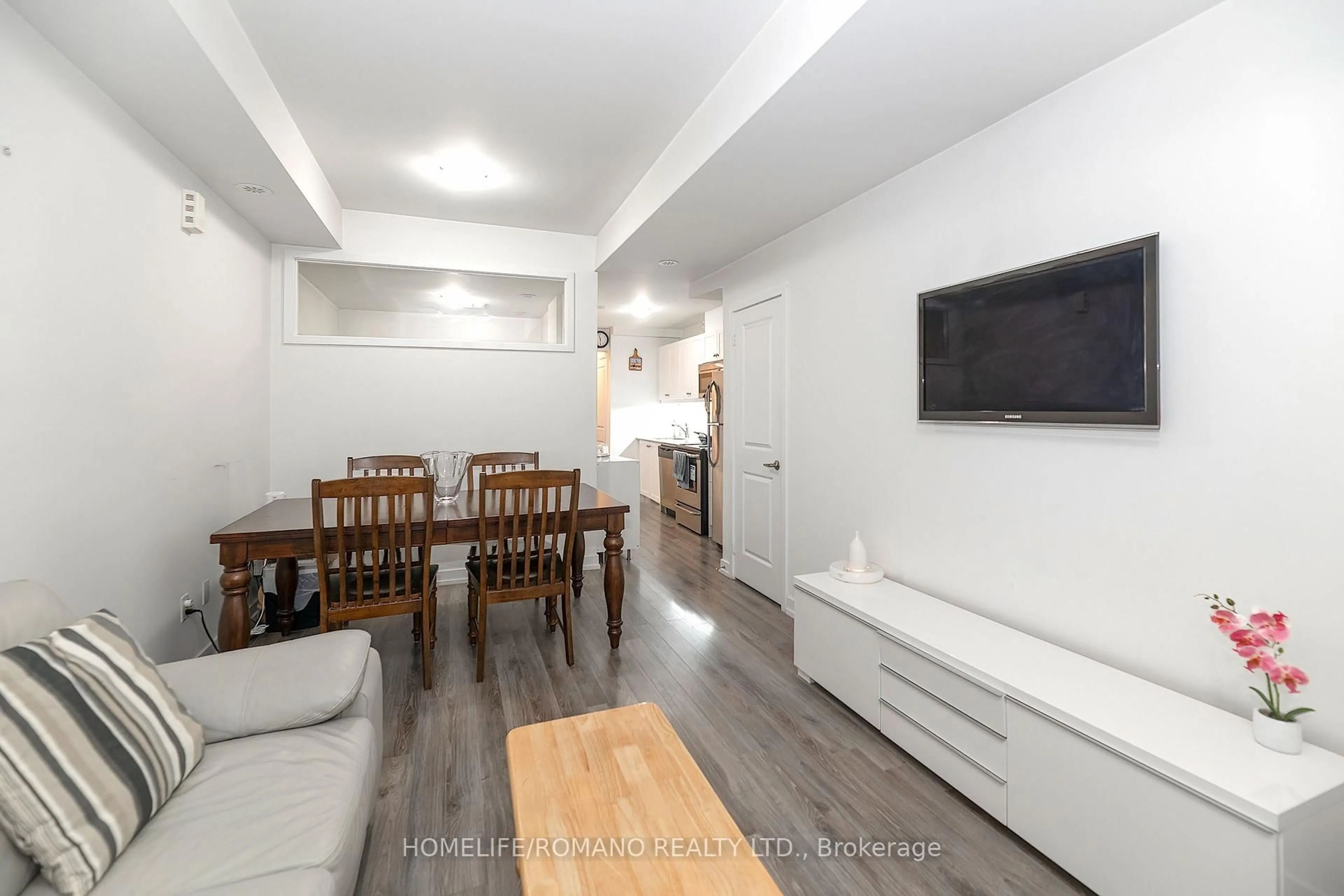 Living room with furniture, wood/laminate floor for 869 Wilson Ave #33, Toronto Ontario M3K 0A4