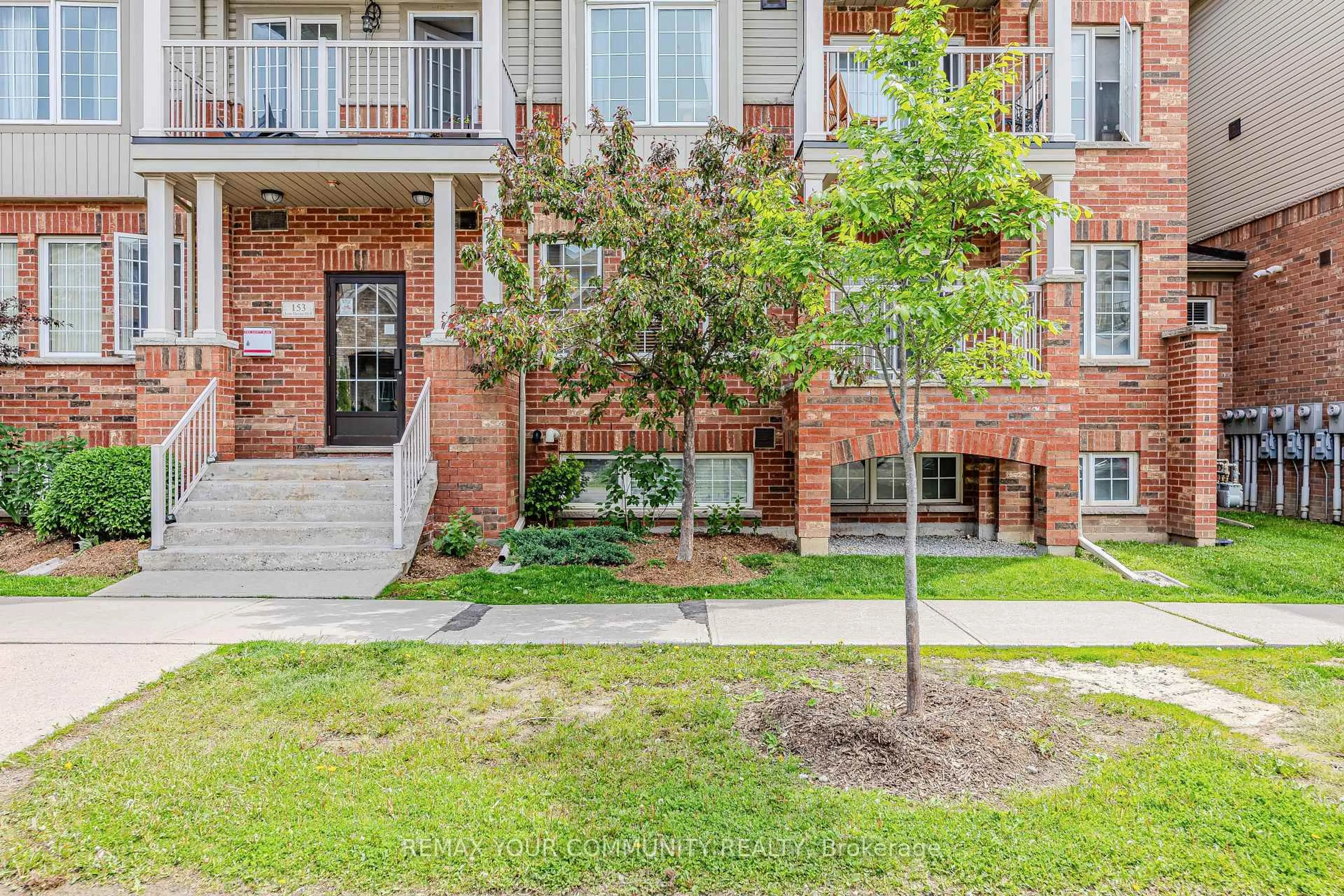 Home with brick exterior material, street for 153 Isaac Devins Blvd #2, Toronto Ontario M9M 0C5