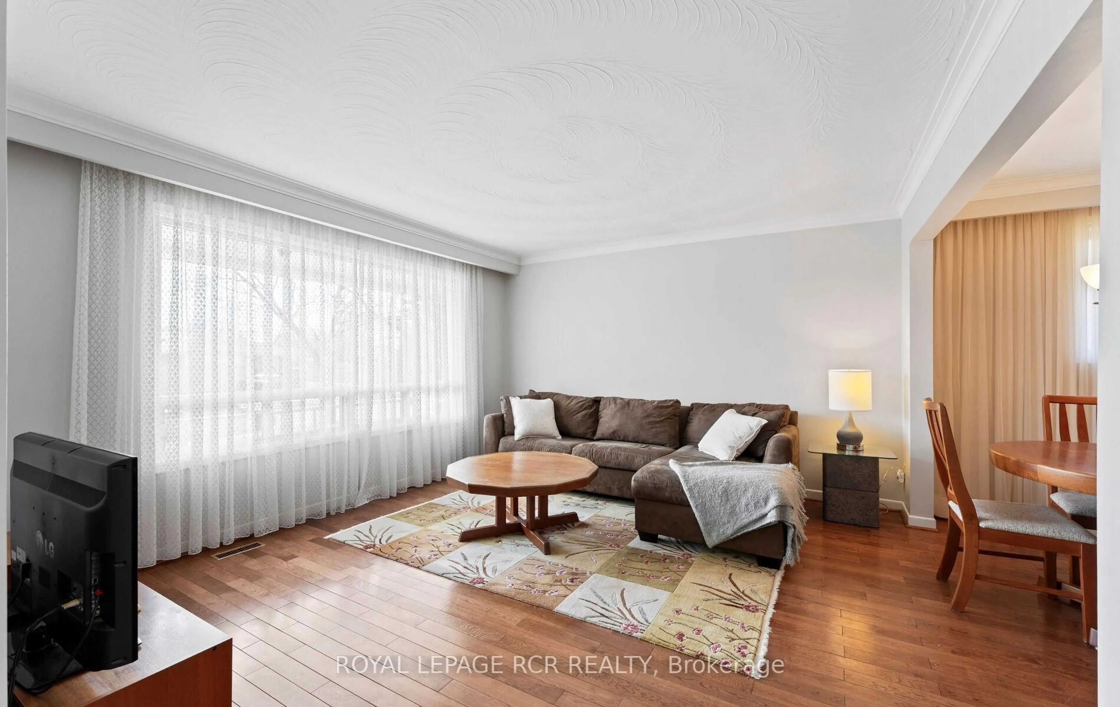 Living room with furniture, wood/laminate floor for 10 West Wareside Rd, Toronto Ontario M9C 3J1