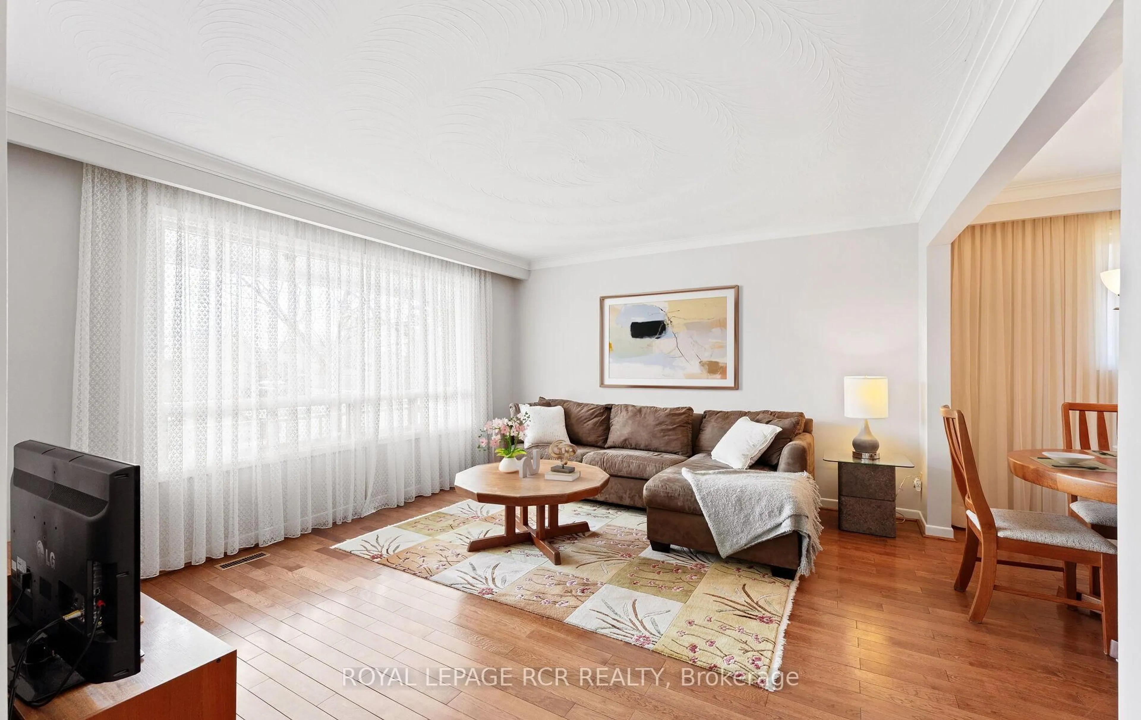 Living room with furniture, wood/laminate floor for 10 West Wareside Rd, Toronto Ontario M9C 3J1