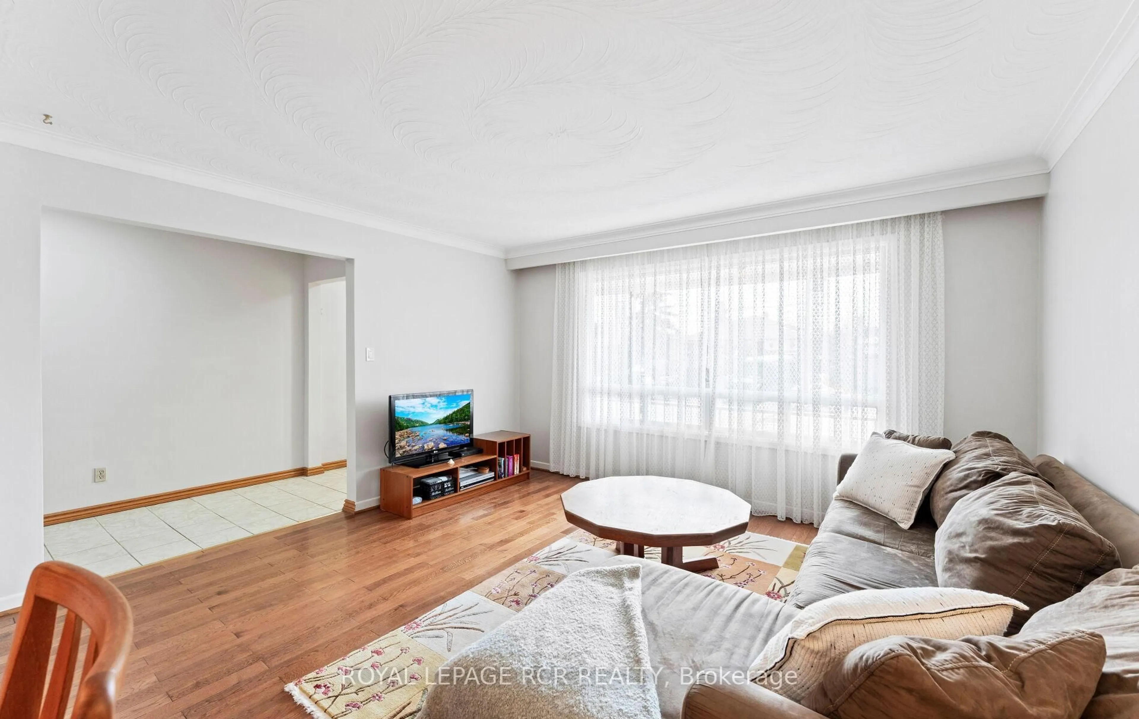 Living room with furniture, wood/laminate floor for 10 West Wareside Rd, Toronto Ontario M9C 3J1