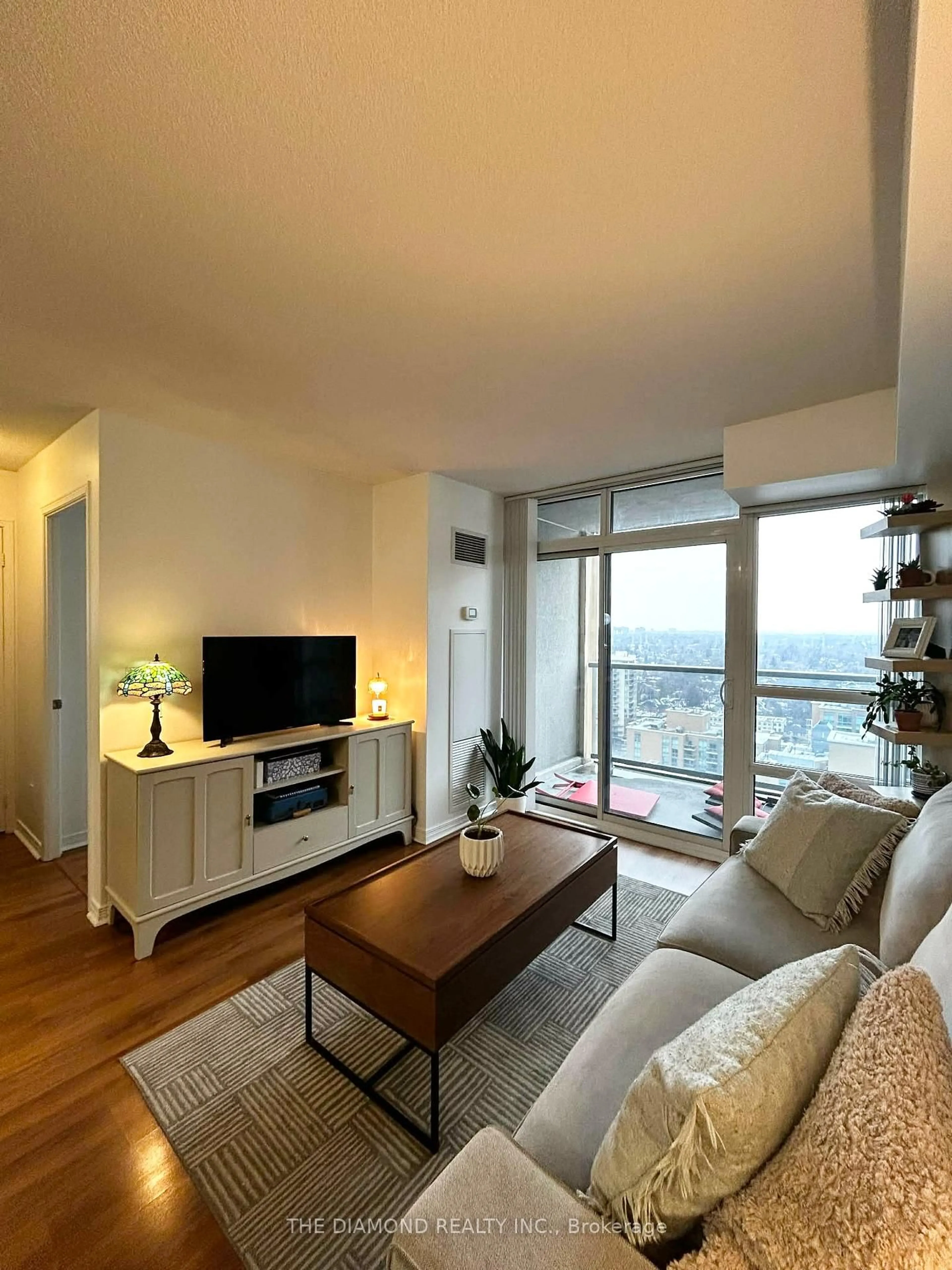 Living room with furniture, wood/laminate floor for 3 Michael Power Pl #2501, Toronto Ontario M9A 0A2