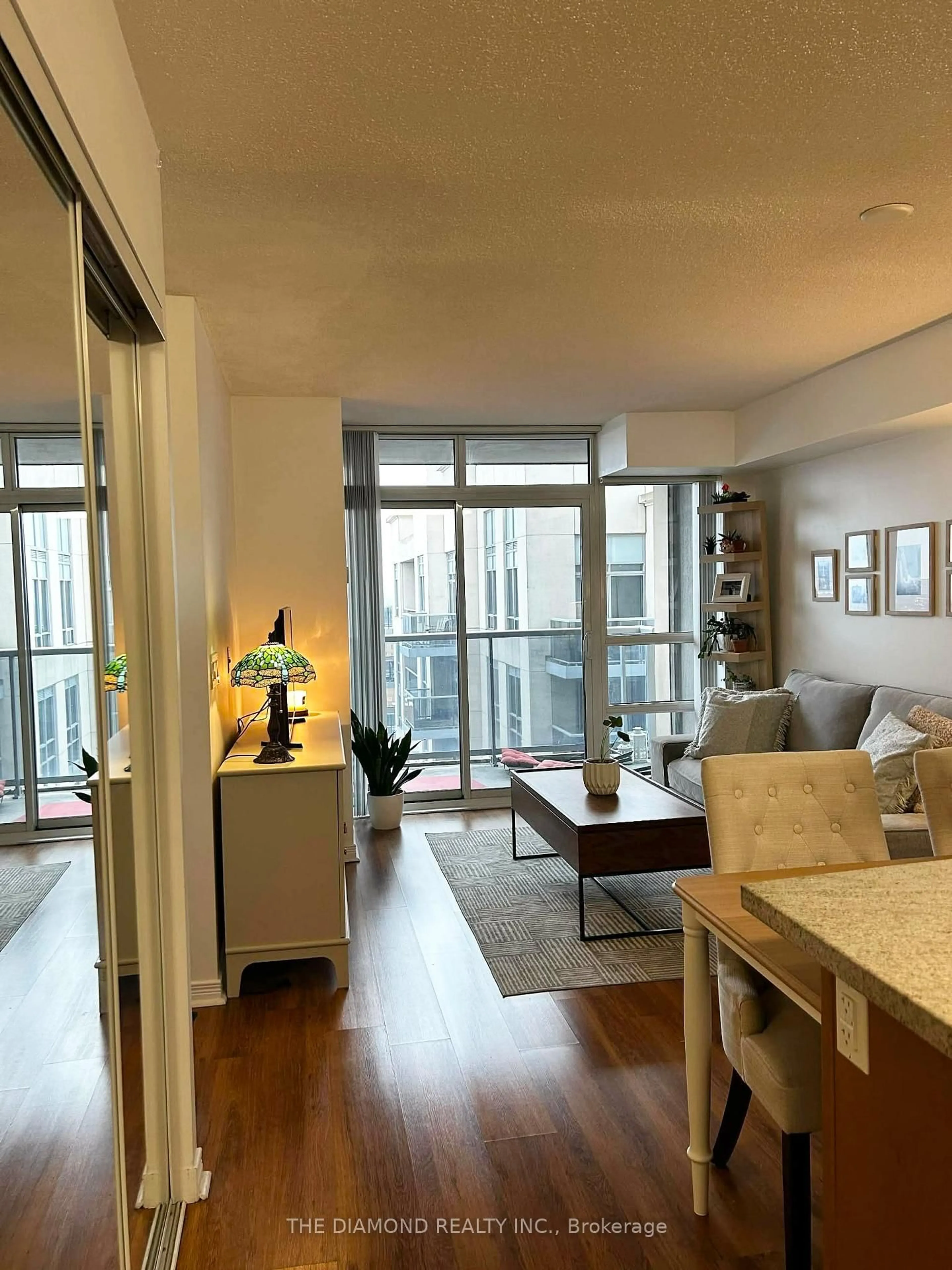 Living room with furniture, wood/laminate floor for 3 Michael Power Pl #2501, Toronto Ontario M9A 0A2