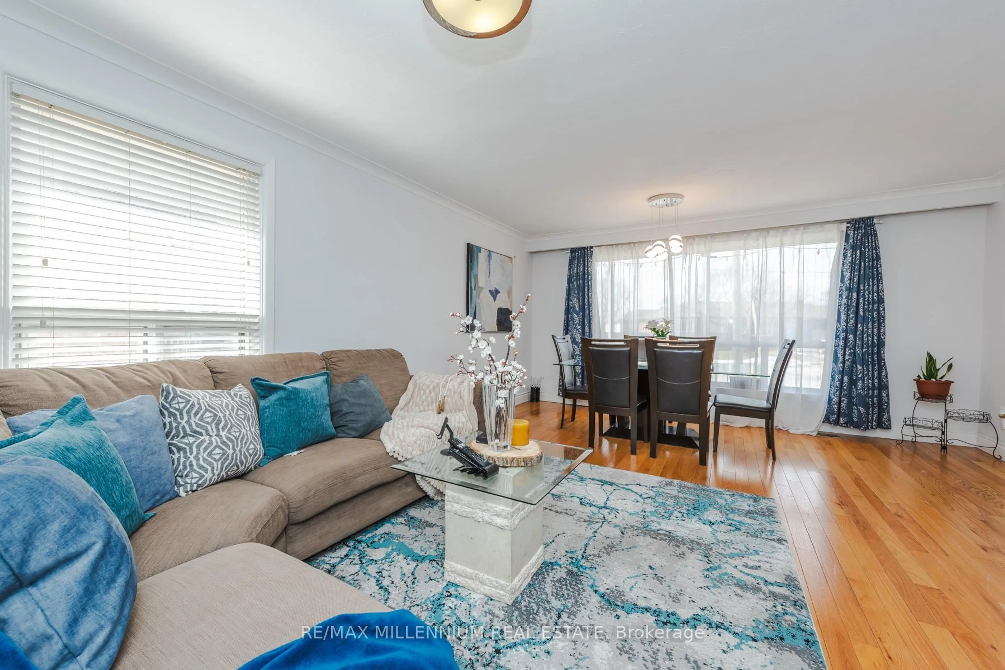 Living room with furniture, wood/laminate floor for 13 Cumberland Dr, Brampton Ontario L6V 1W5