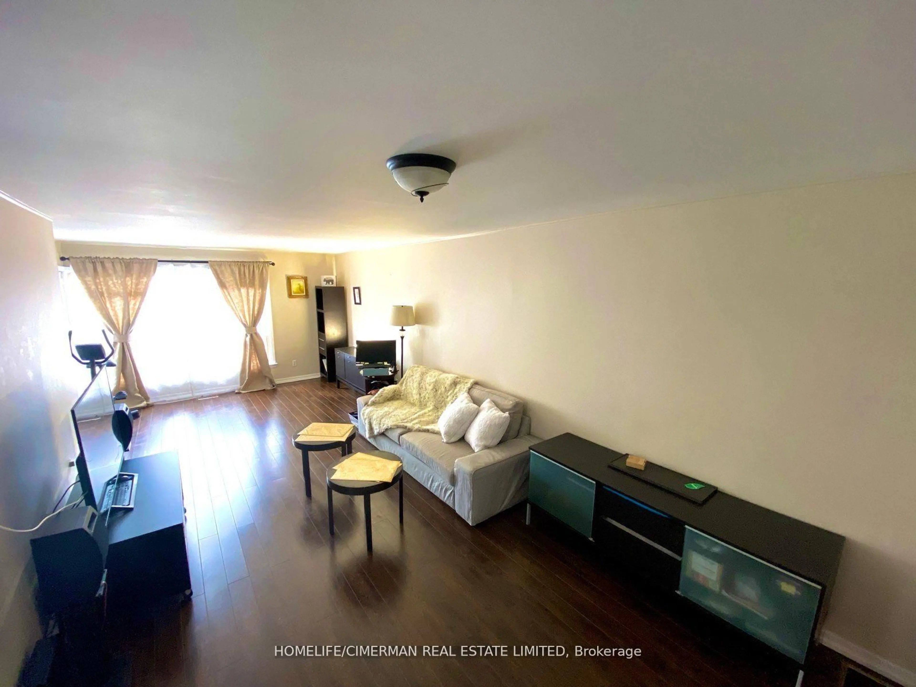 Living room with furniture, wood/laminate floor for 3 Benton St, Brampton Ontario L6W 3B8