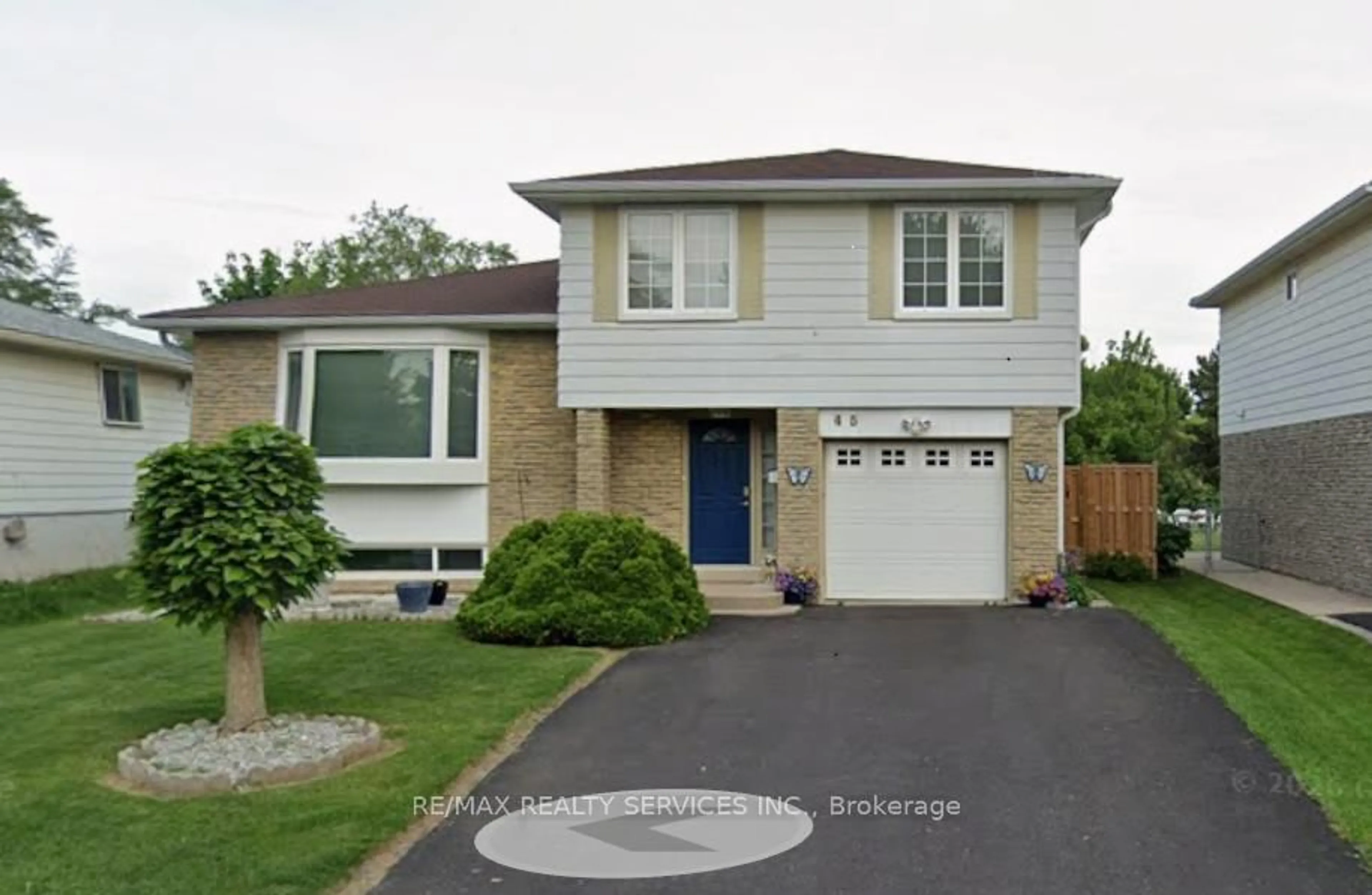 Home with vinyl exterior material, street for 45 Grassington Cres, Brampton Ontario L6S 1Z5