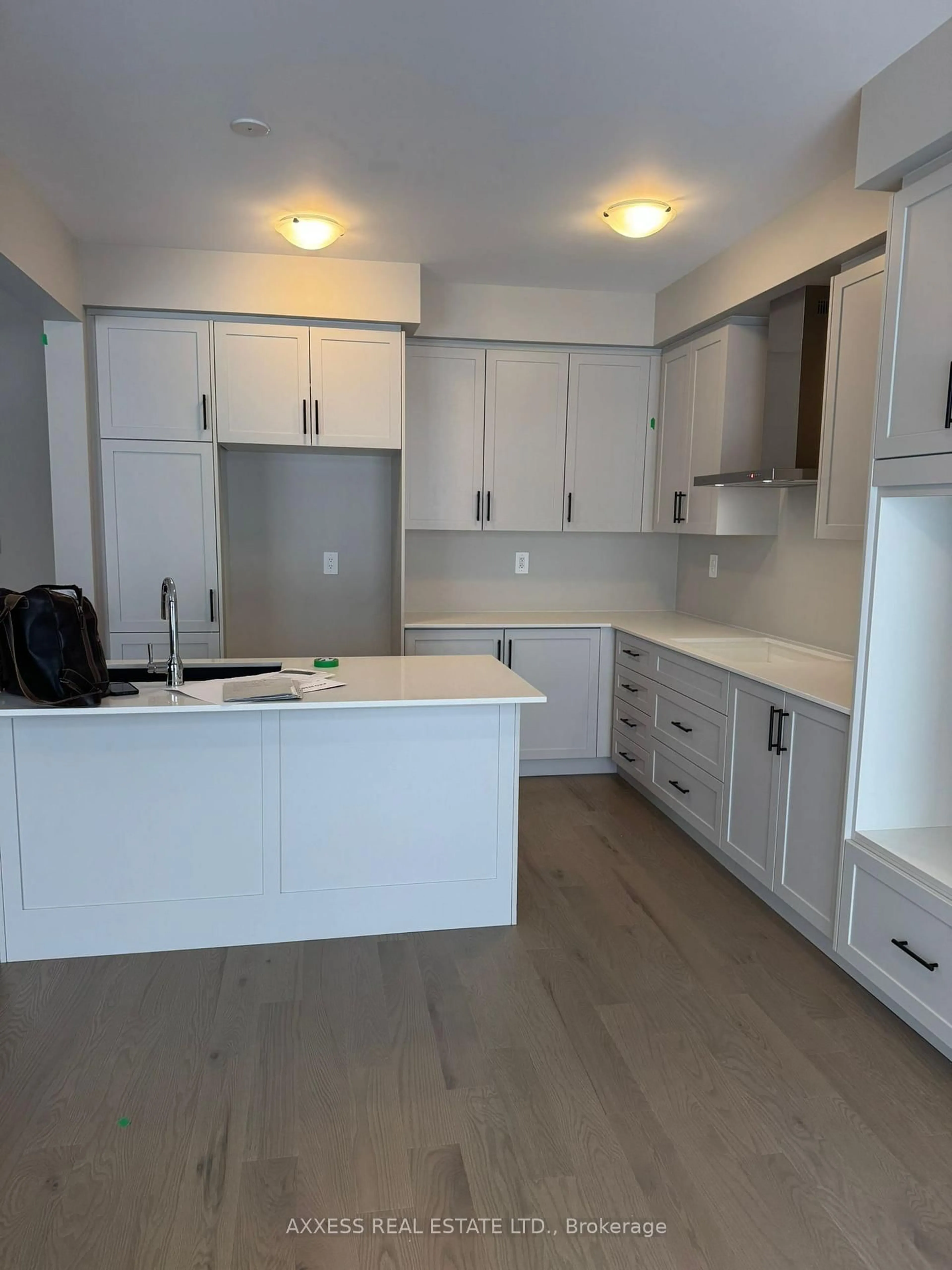 Open concept kitchen, wood/laminate floor for 11 Misted Breeze St, Brampton Ontario L6Y 6M1