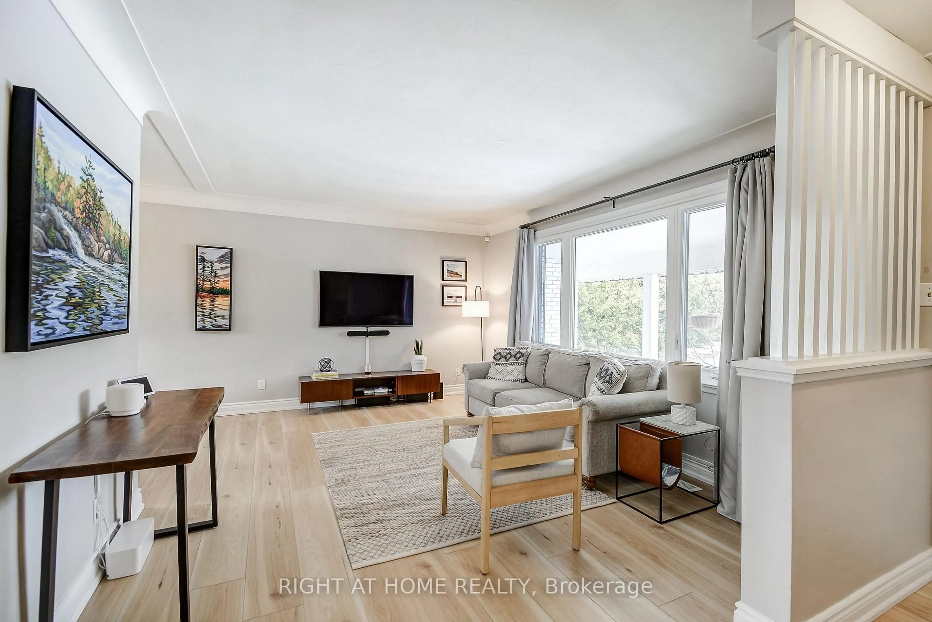 Living room with furniture, wood/laminate floor for 1300 Princeton Cres, Burlington Ontario L7P 2K5