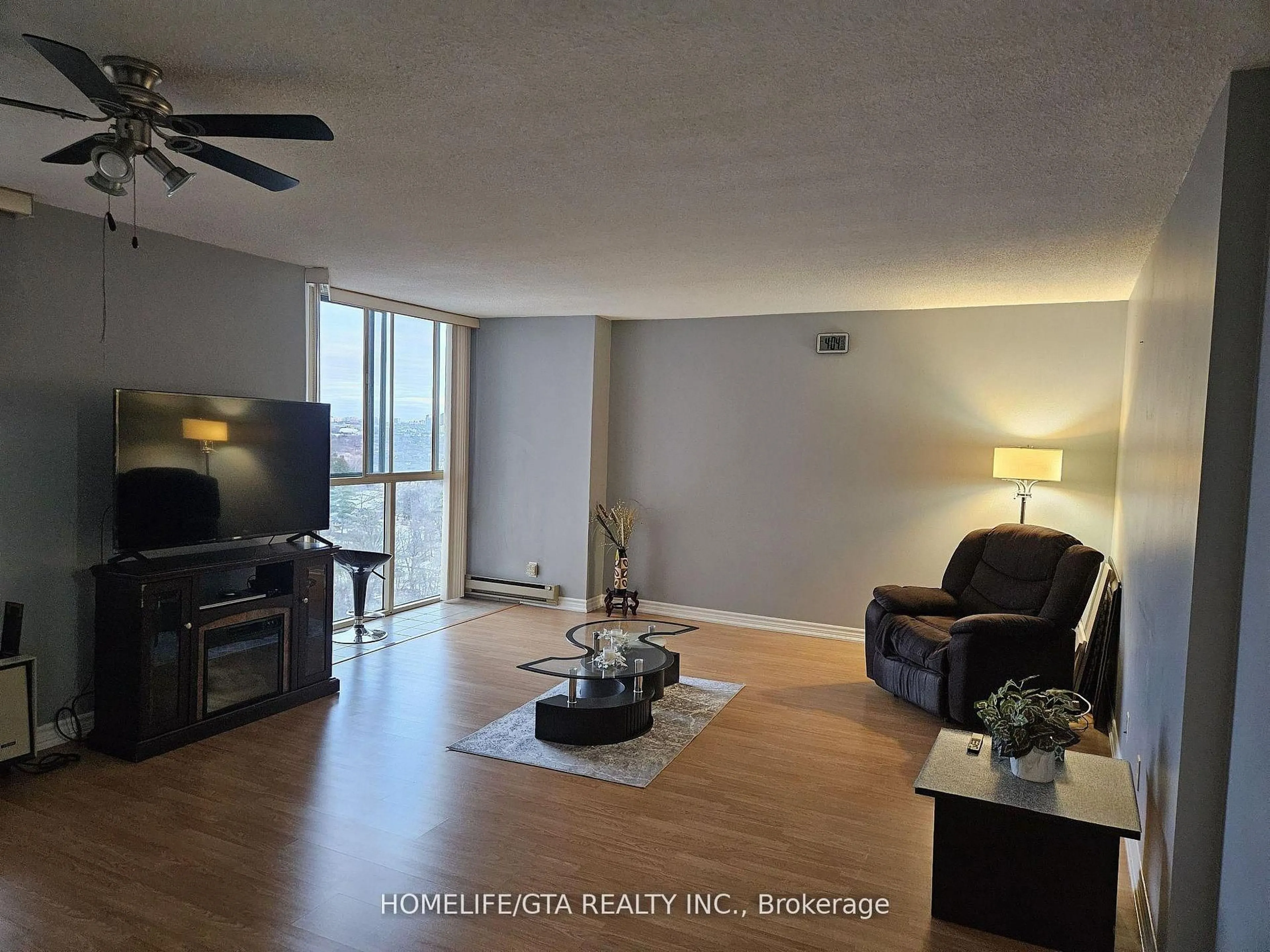 Living room with furniture, wood/laminate floor for 41 Markbrook Lane #1409, Toronto Ontario M9V 5E6