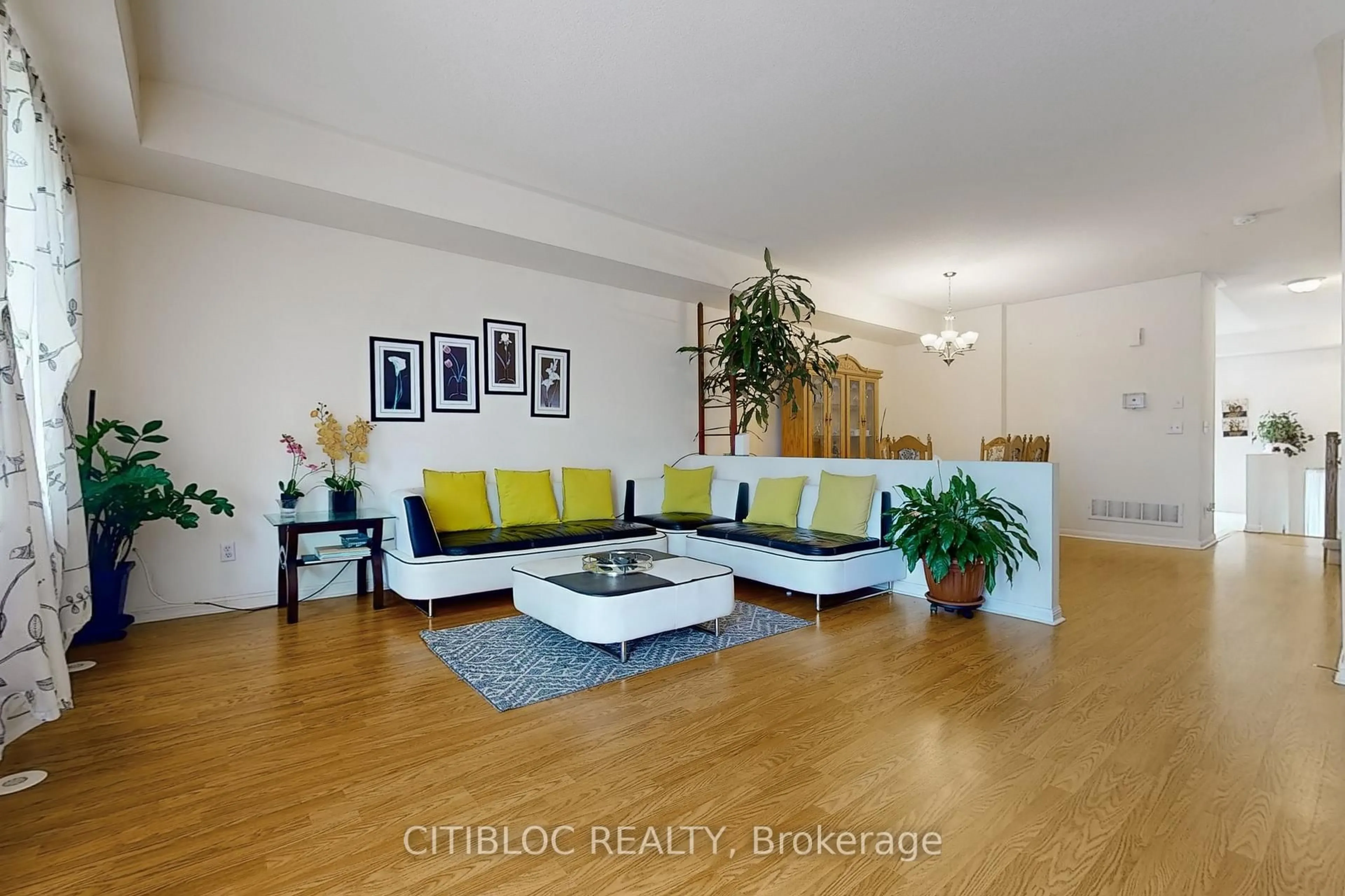 Living room with furniture, wood/laminate floor for 3029 Finch Ave #13, Toronto Ontario M9M 0A2