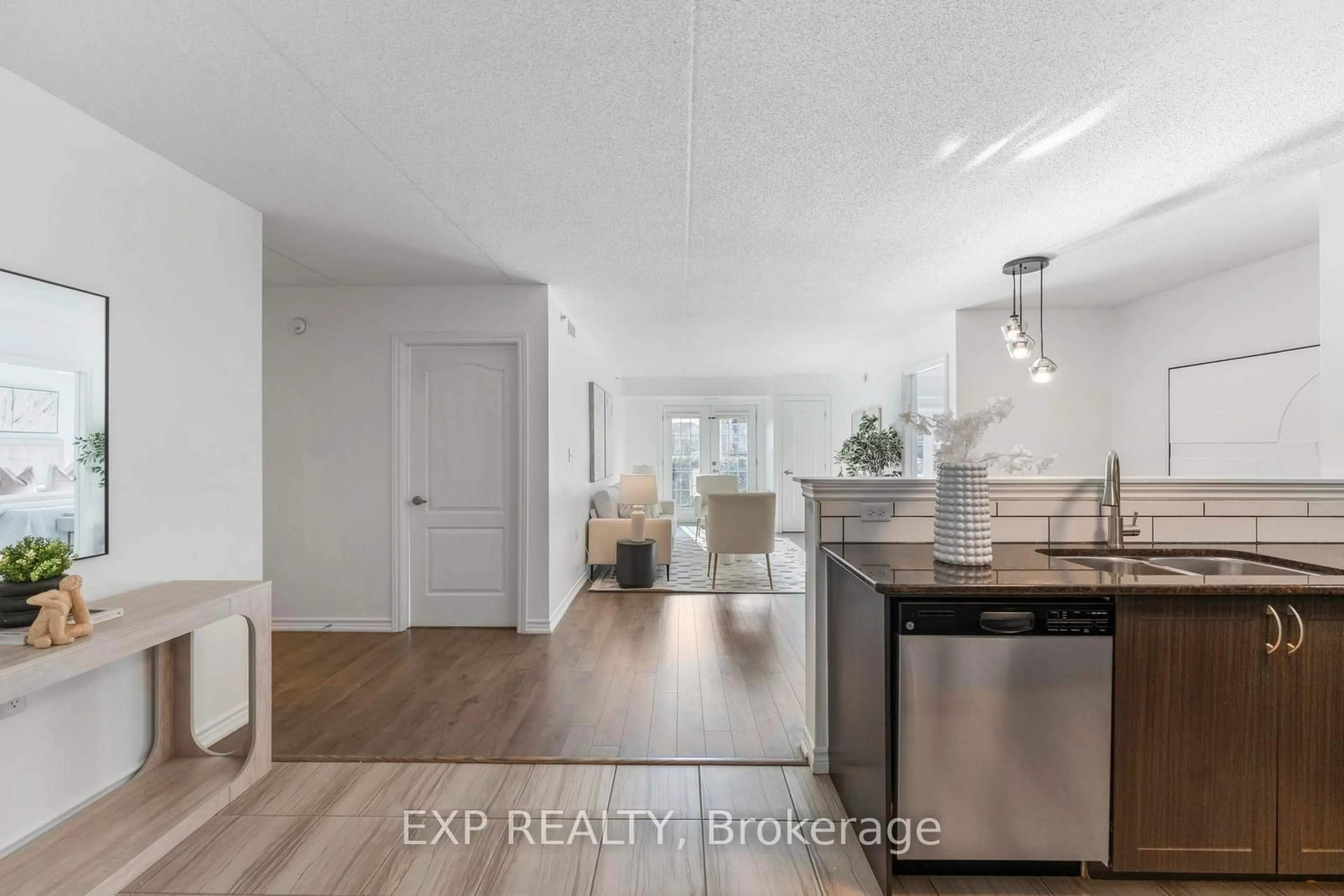 Open concept kitchen, wood/laminate floor for 1460 Main St #104, Milton Ontario L9T 8W5