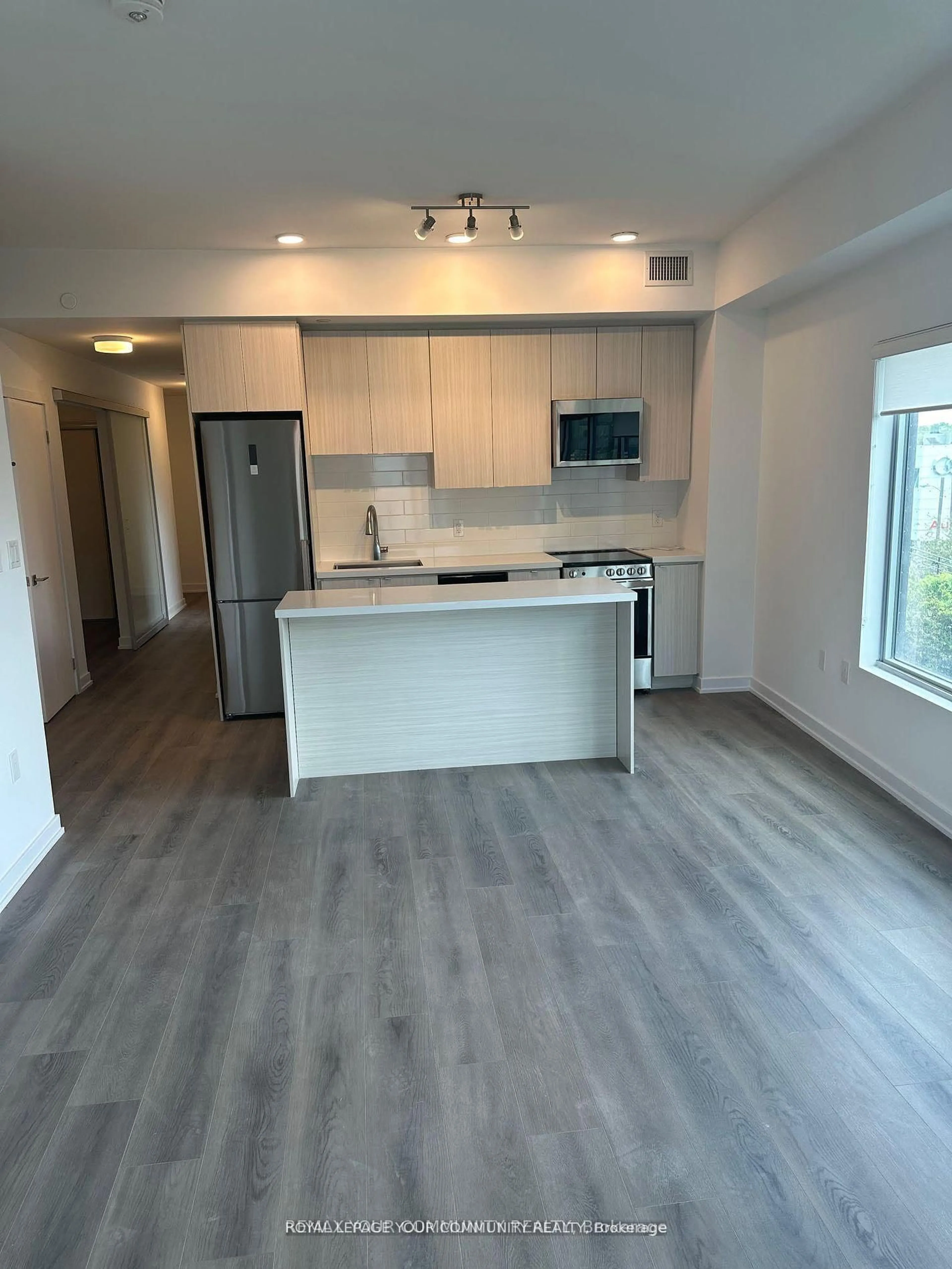 Open concept kitchen, wood/laminate floor for 2433 Dufferin St #313, Toronto Ontario M6E 0B4