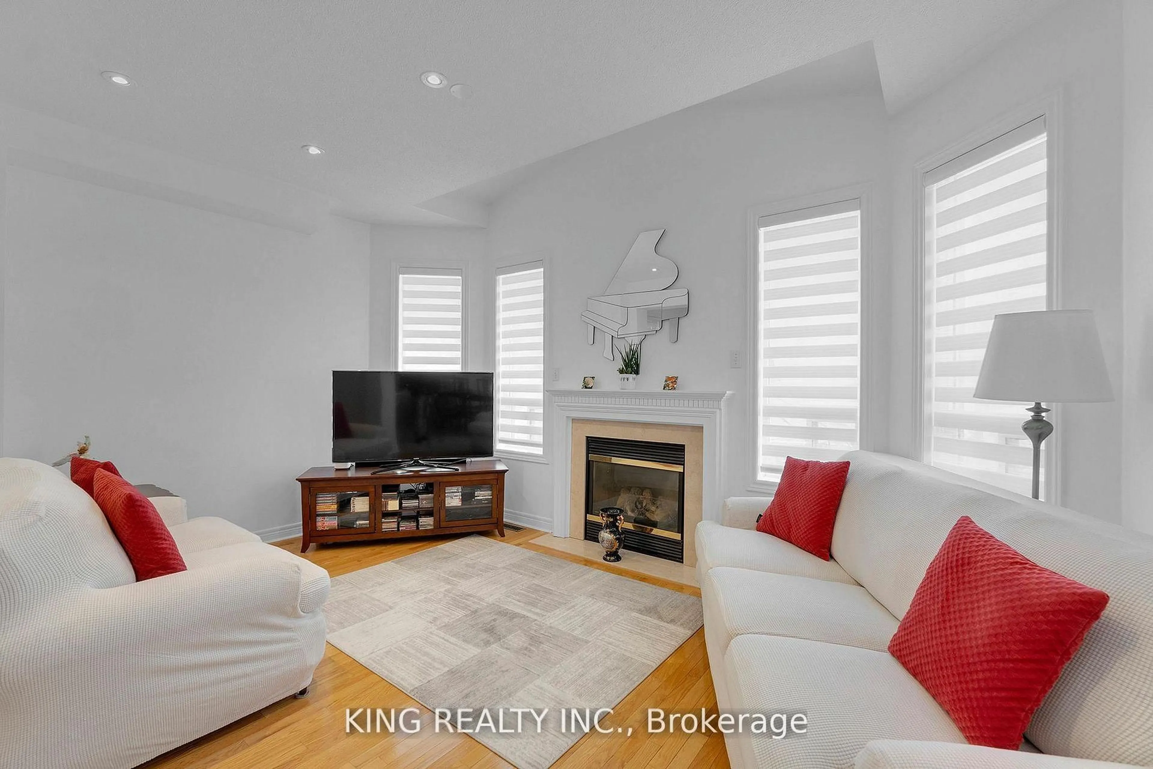 Living room with furniture, wood/laminate floor for 66 Saffron Cres, Brampton Ontario L6S 6H7