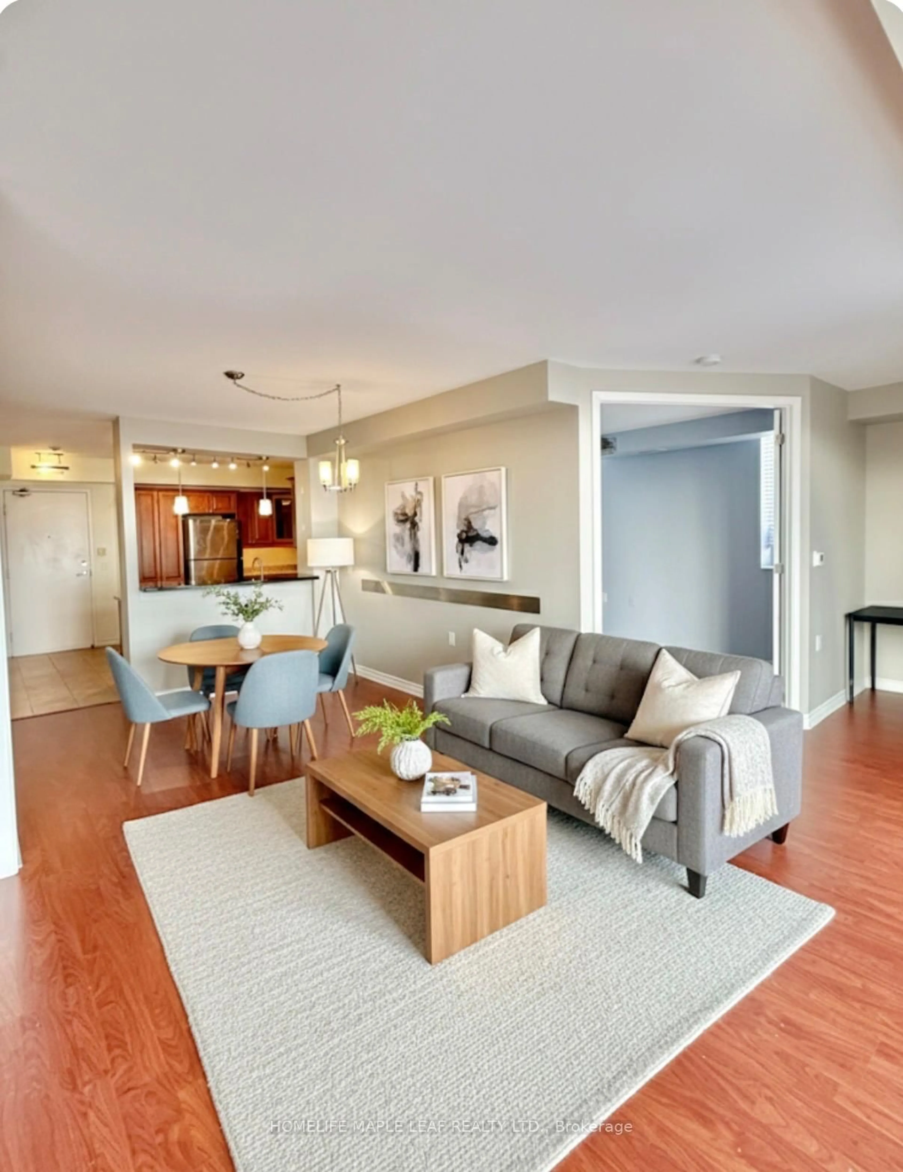 Living room with furniture, wood/laminate floor for 200 Burnhamthorpe Rd #1304, Mississauga Ontario L5A 4L4