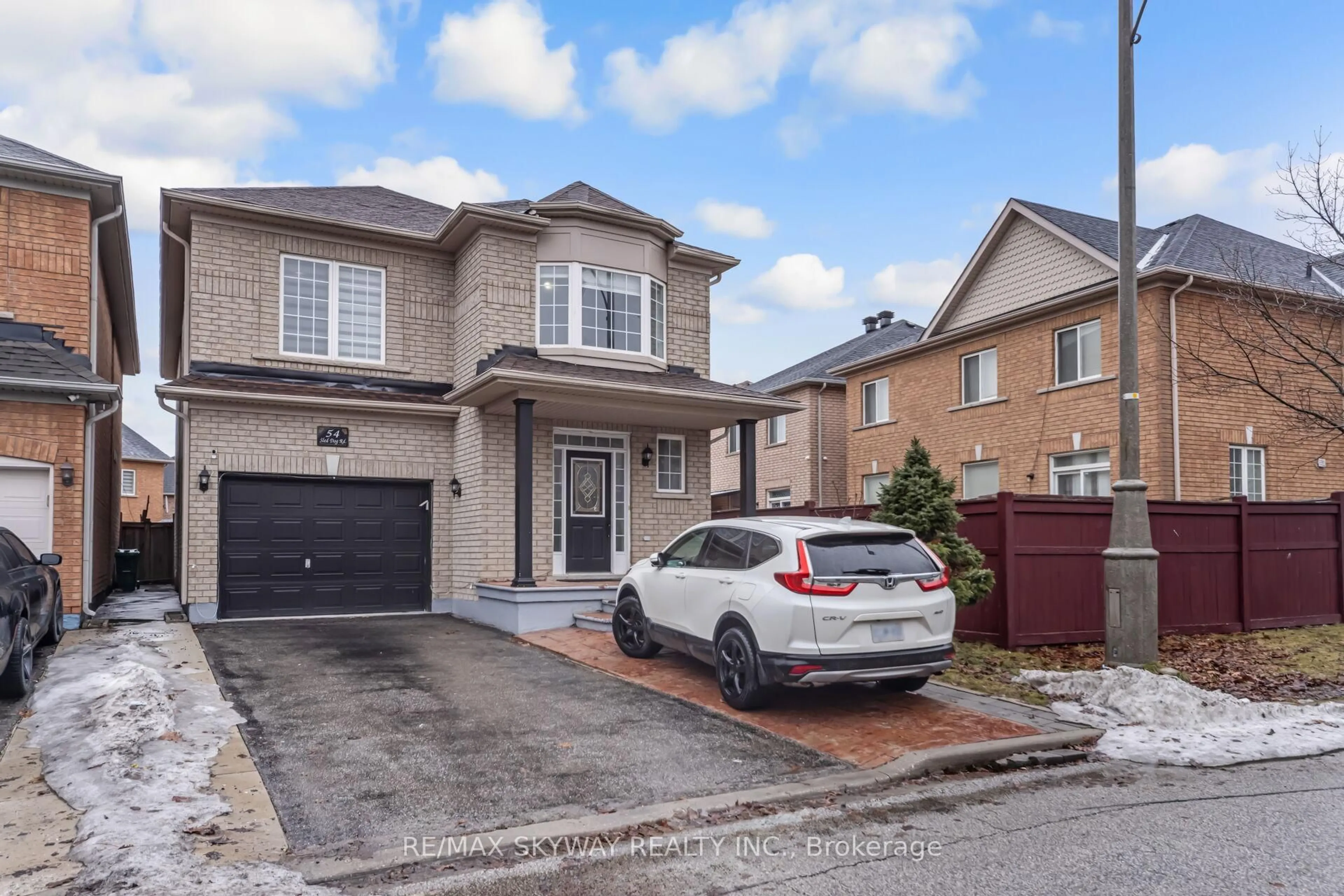 Home with brick exterior material, street for 54 Sled Dog Rd, Brampton Ontario L6R 0J7