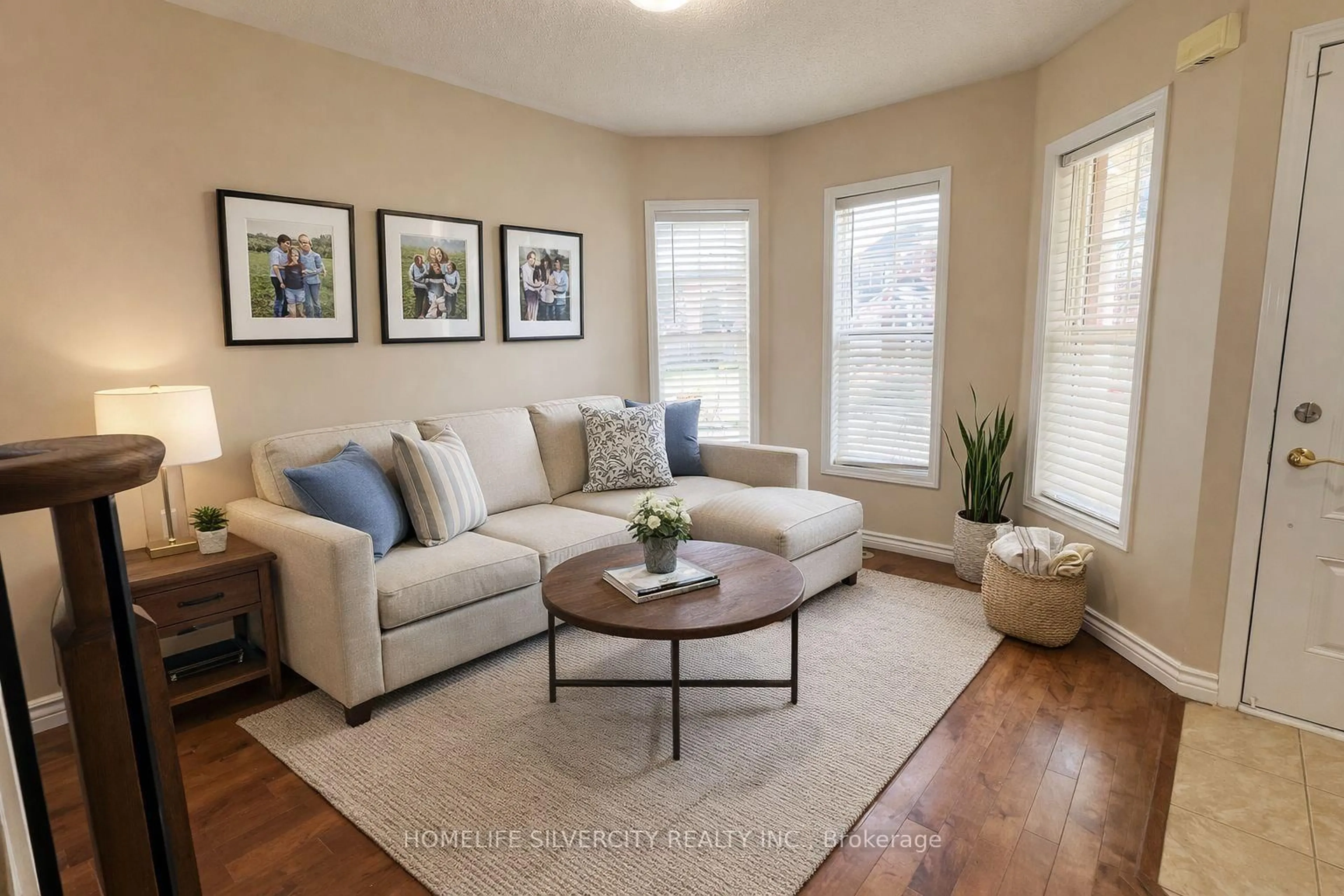 Living room with furniture, wood/laminate floor for 907 Zelinsky Cres, Milton Ontario L9T 0L5