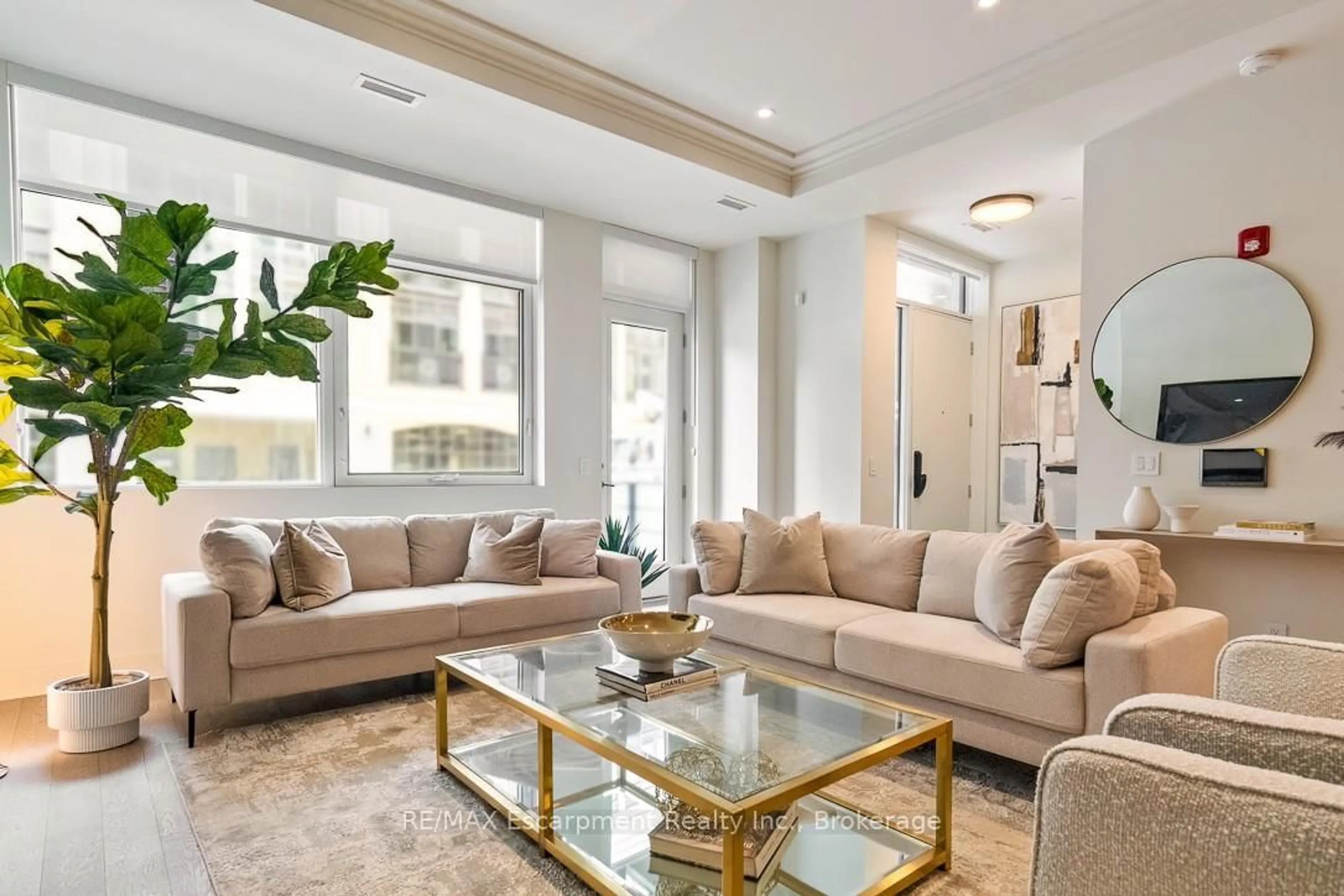 Living room with furniture, unknown for 123 Maurice Dr #105, Oakville Ontario L6K 2W6