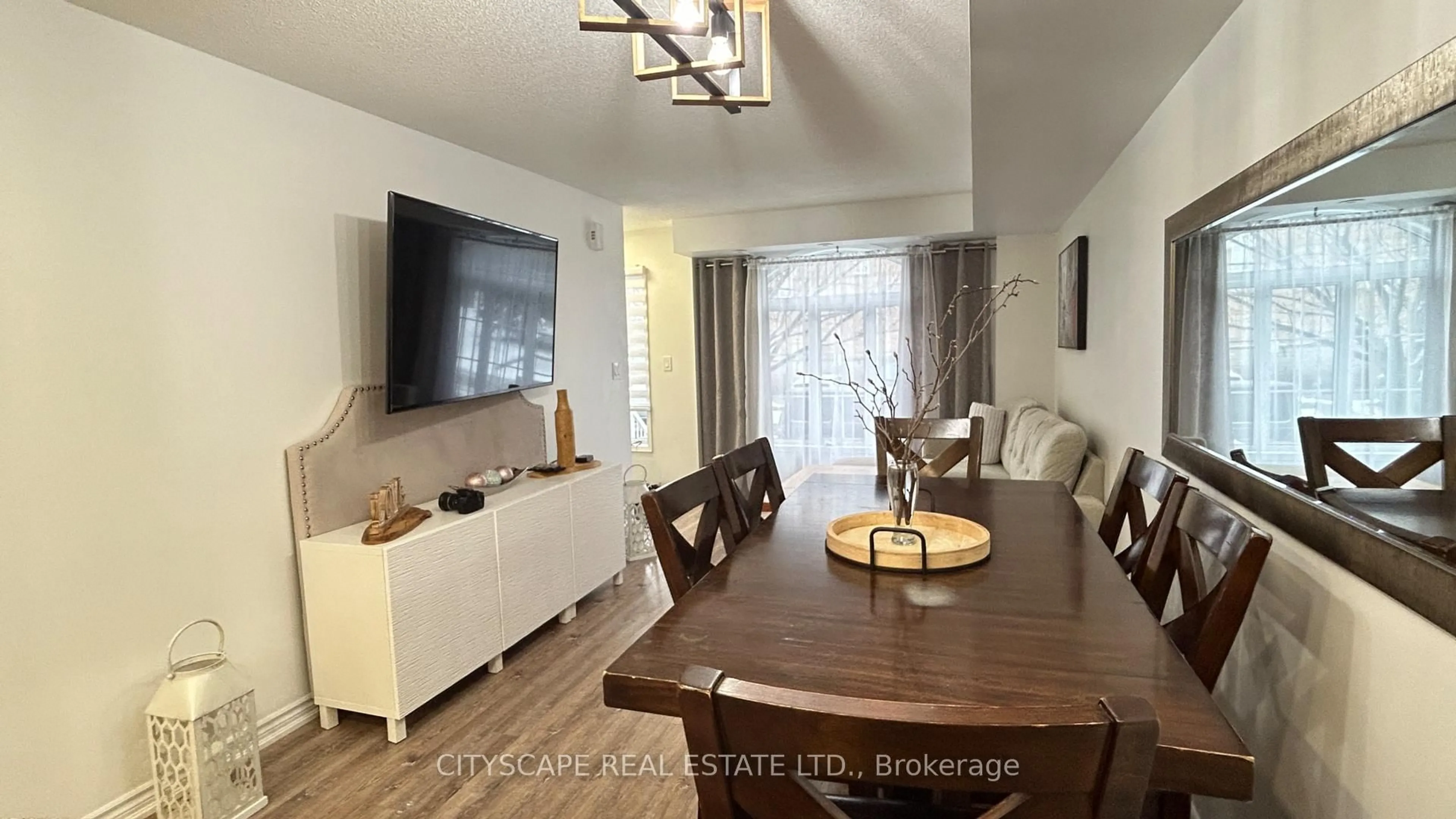 Living room with furniture, wood/laminate floor for 601 Shoreline Dr #162, Mississauga Ontario L5B 4K1