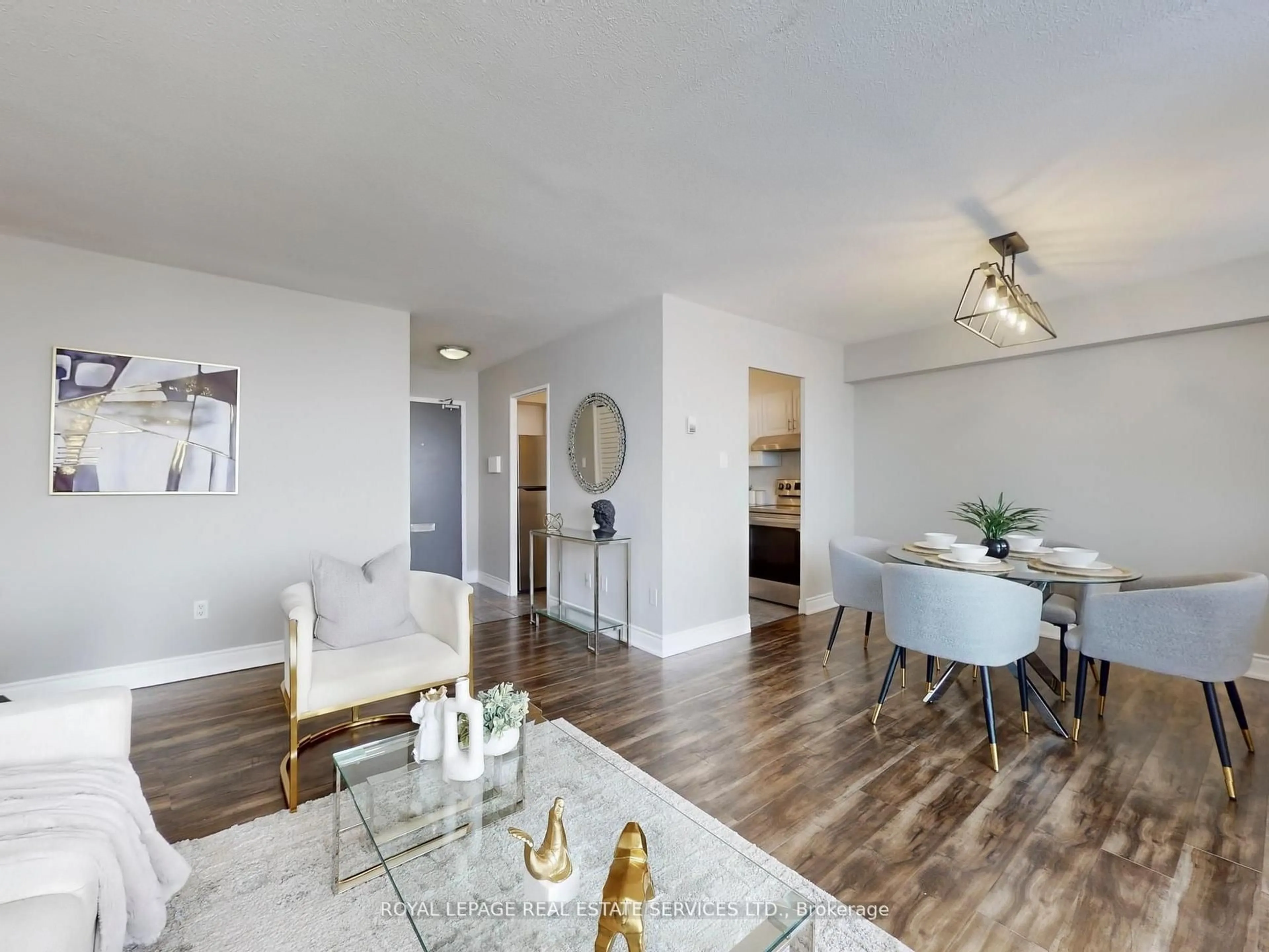 Living room with furniture, wood/laminate floor for 551 The West Mall #702, Toronto Ontario M9C 1G7