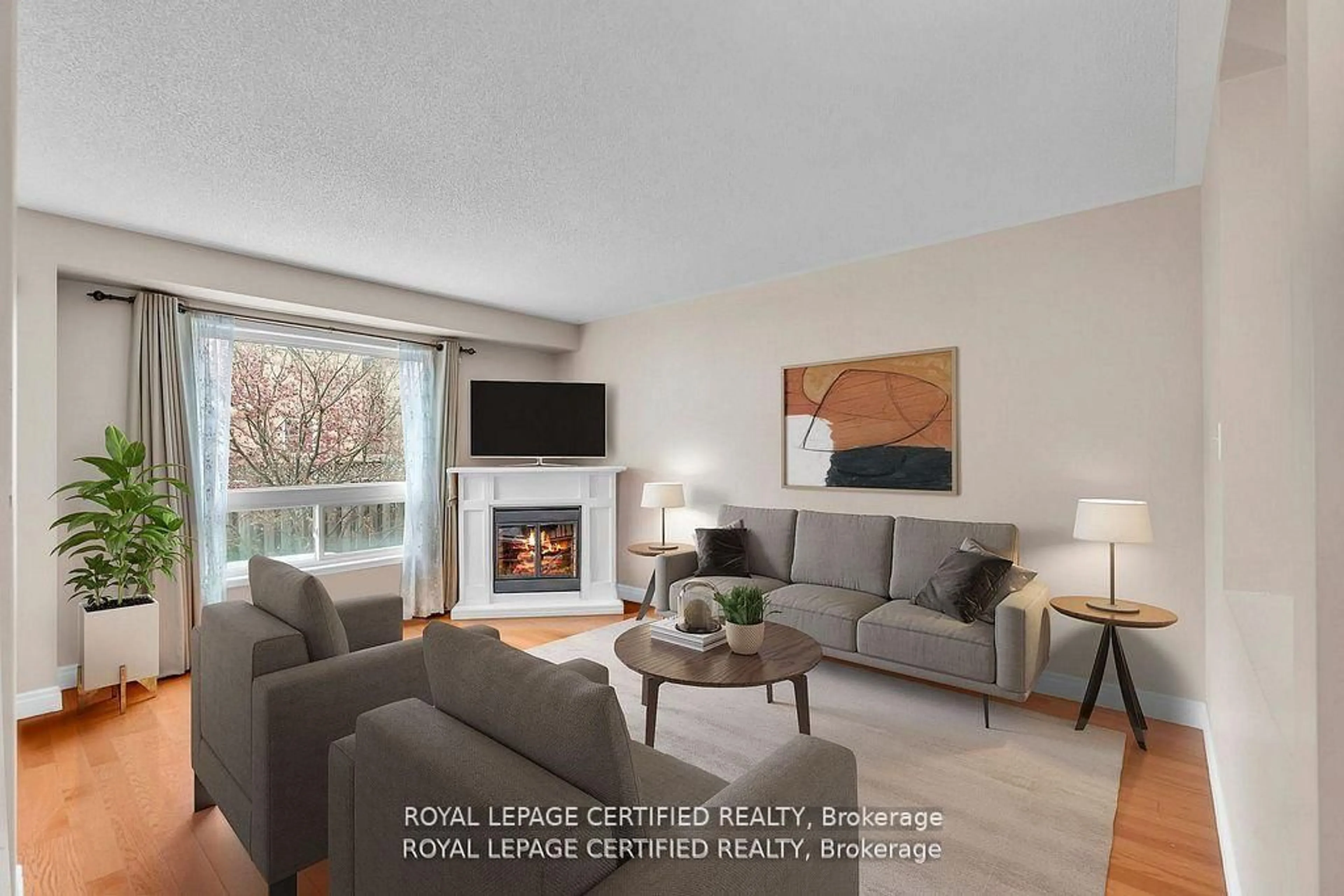 Living room with furniture, wood/laminate floor for 17 Chestermere Cres, Brampton Ontario L7A 2E8