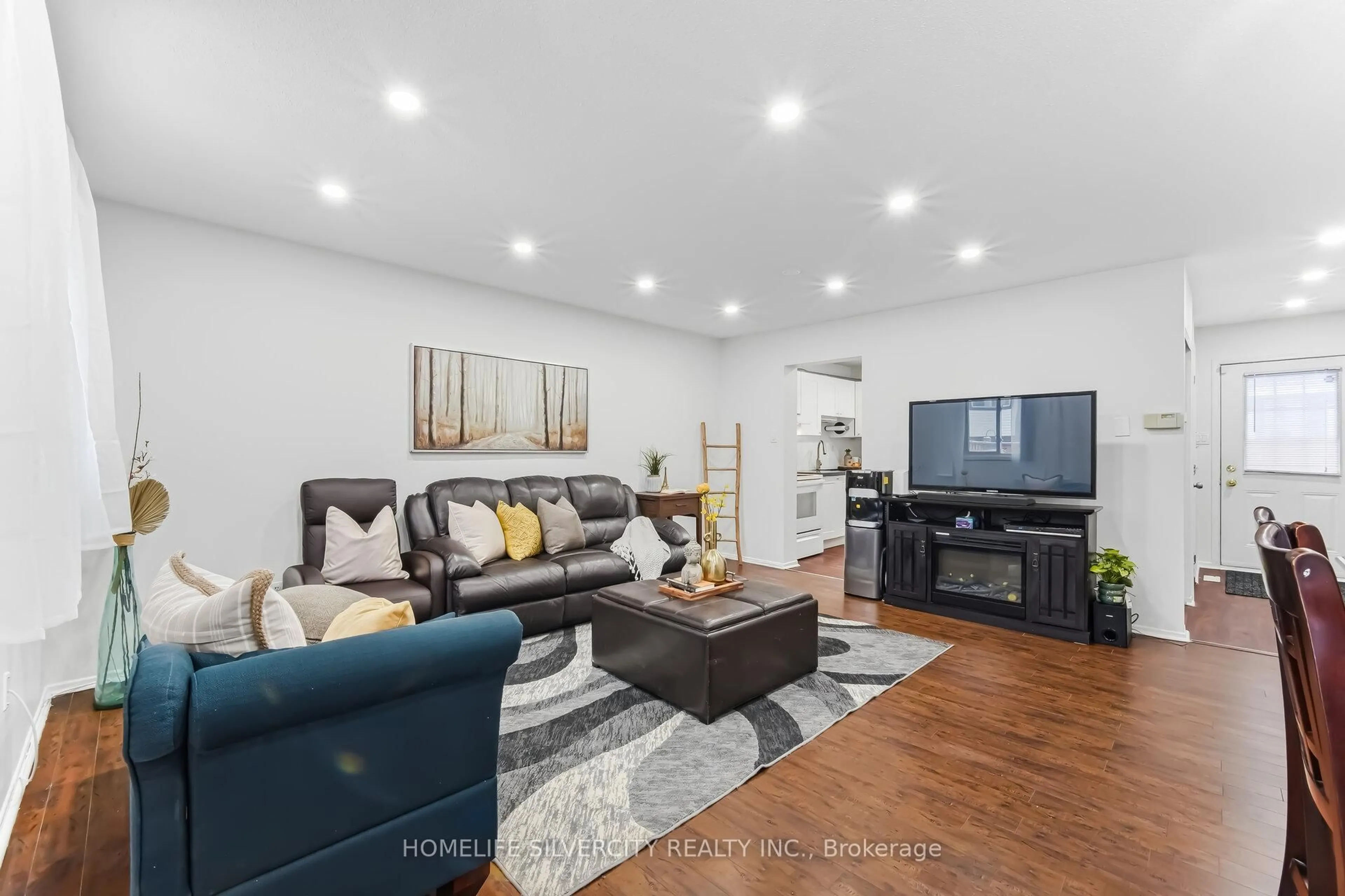 Living room with furniture, unknown for 45 Hansen Rd #100, Brampton Ontario L6V 3C5