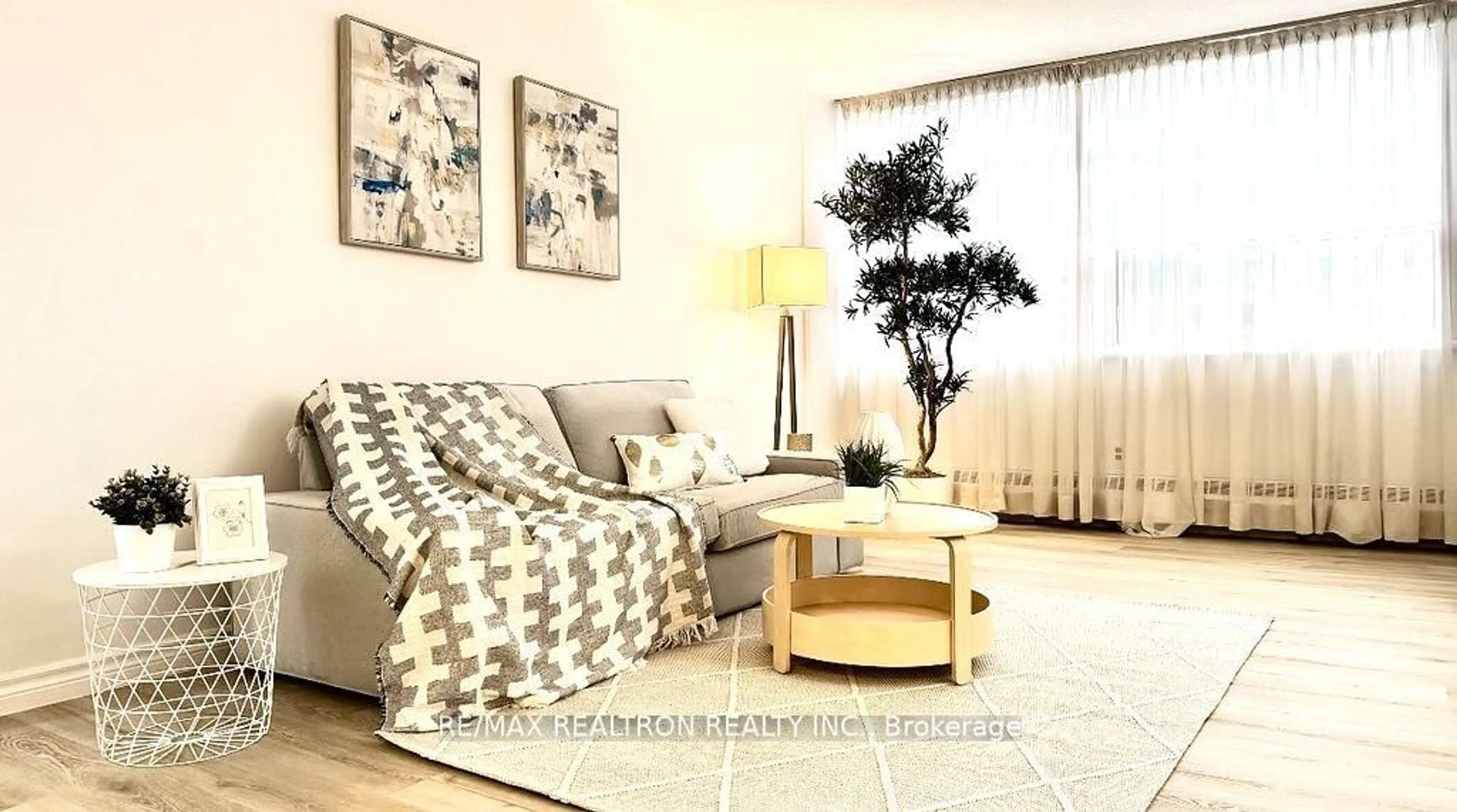 Living room with furniture, wood/laminate floor for 451 The West Mall #218, Toronto Ontario M9C 1G1