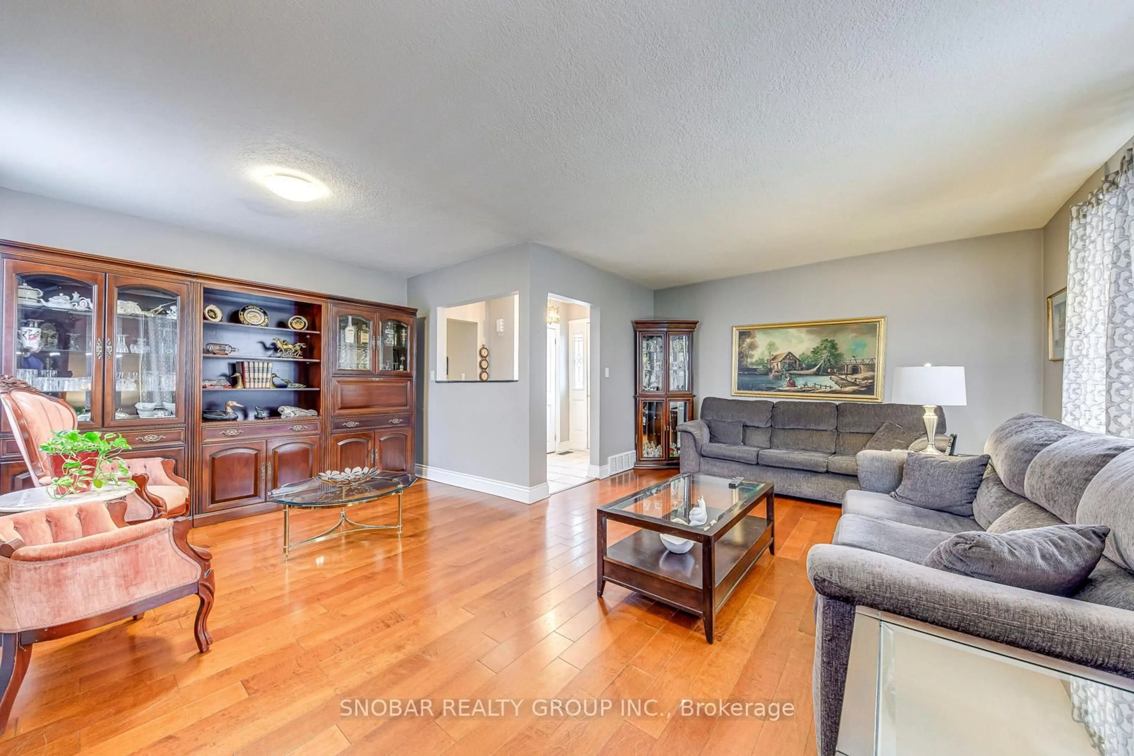 Living room with furniture, wood/laminate floor for 22 Coolhurst Dr, Toronto Ontario M9W 4A5