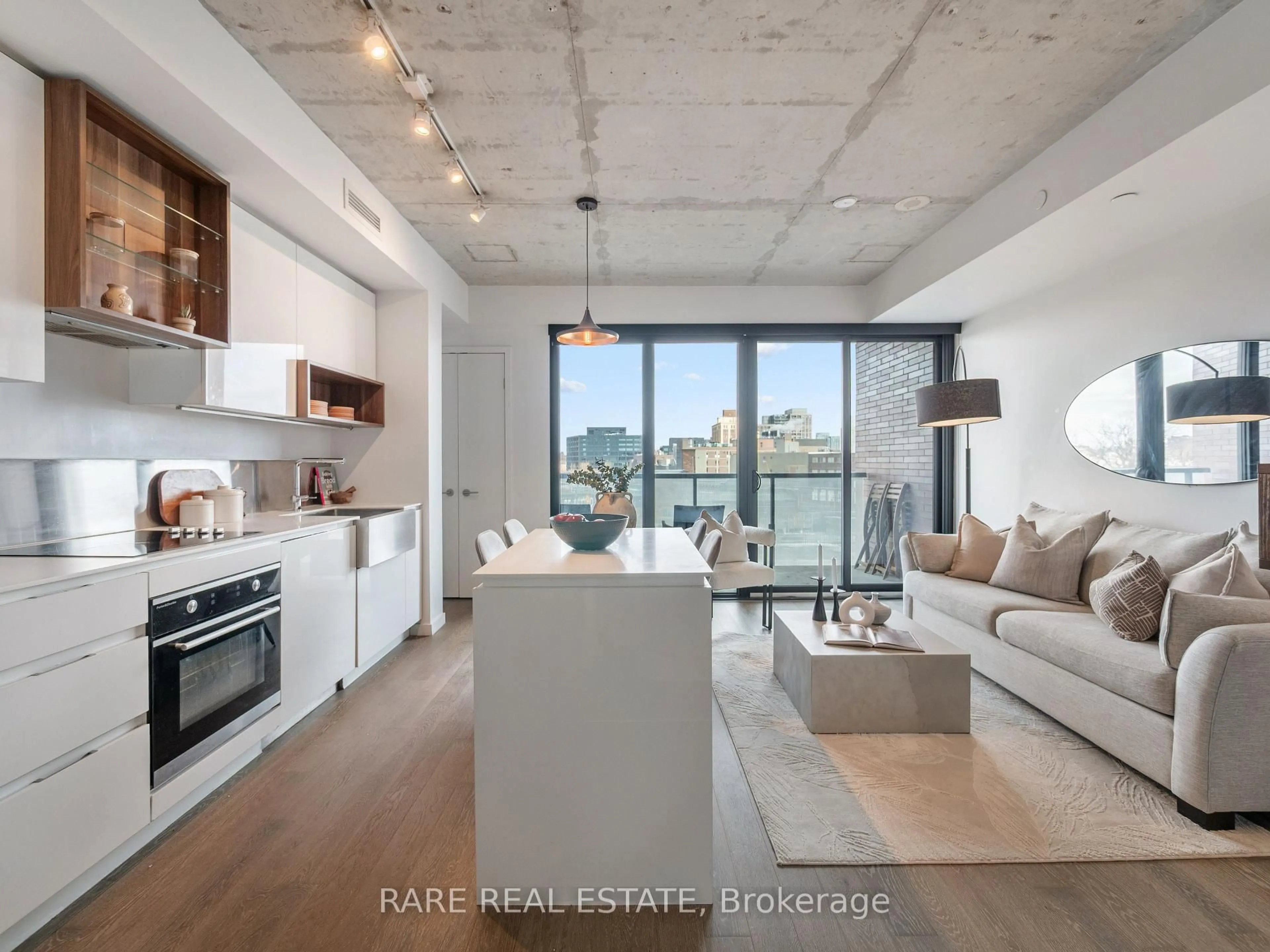 Open concept kitchen, cement floor for 383 Sorauren Ave #608, Toronto Ontario M6R 0A4